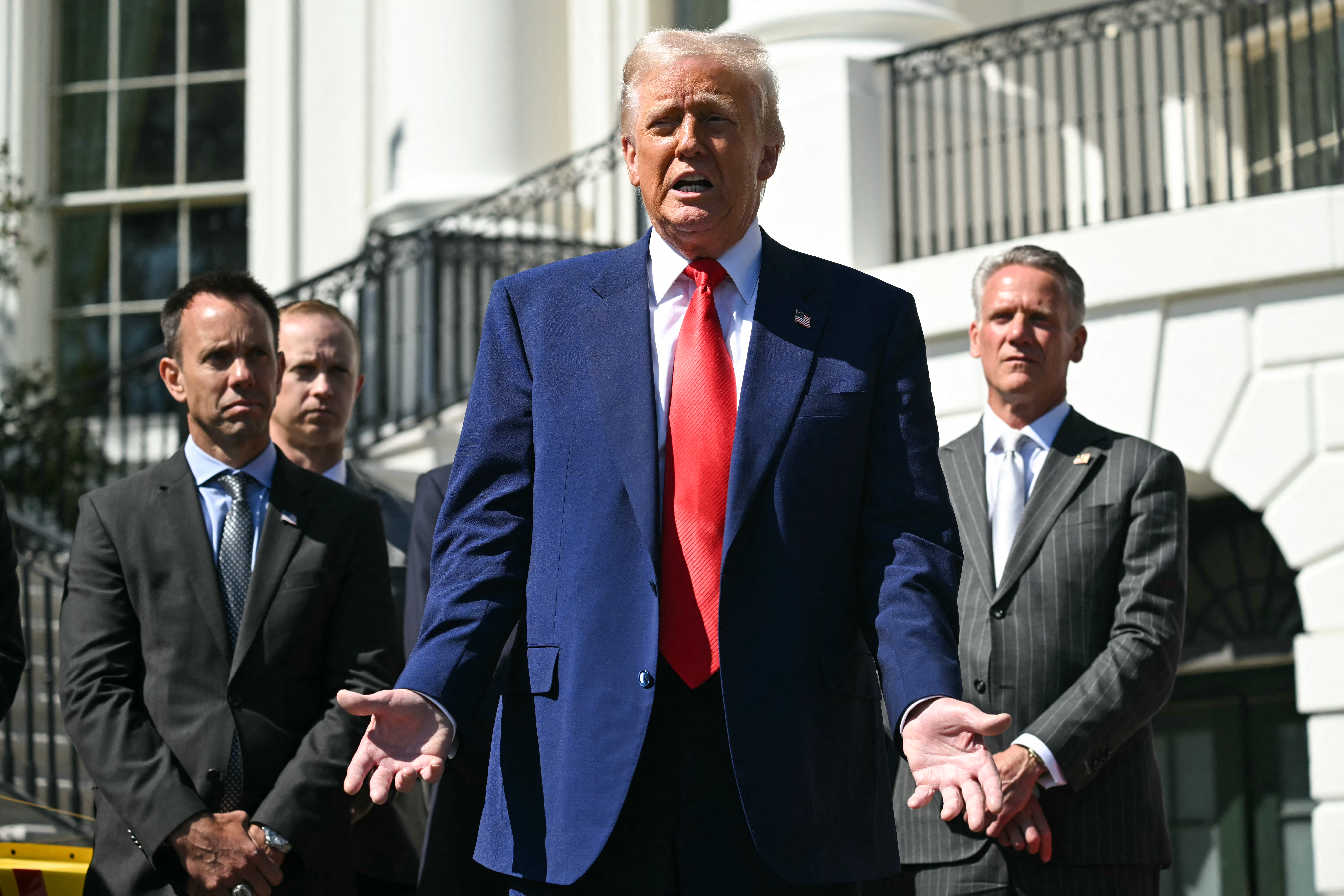 US President Donald Trump speaks during a photo session with auto racing officials and champions on the South Portico of the White House.