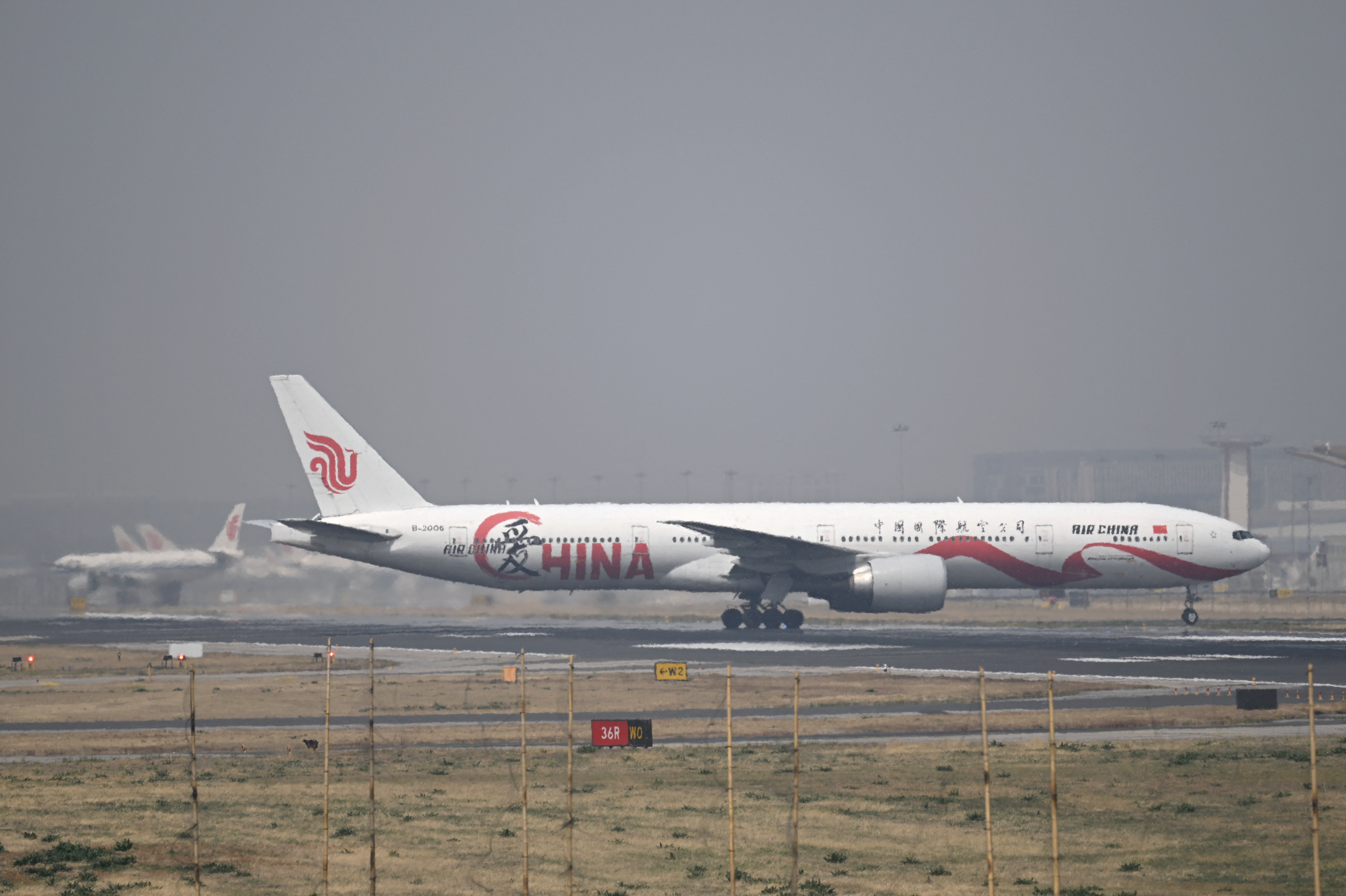 An Air China Boeing 777-300 taxis at Beijing International airport on April 10, 2025. (Photo by WANG Zhao / AFP)