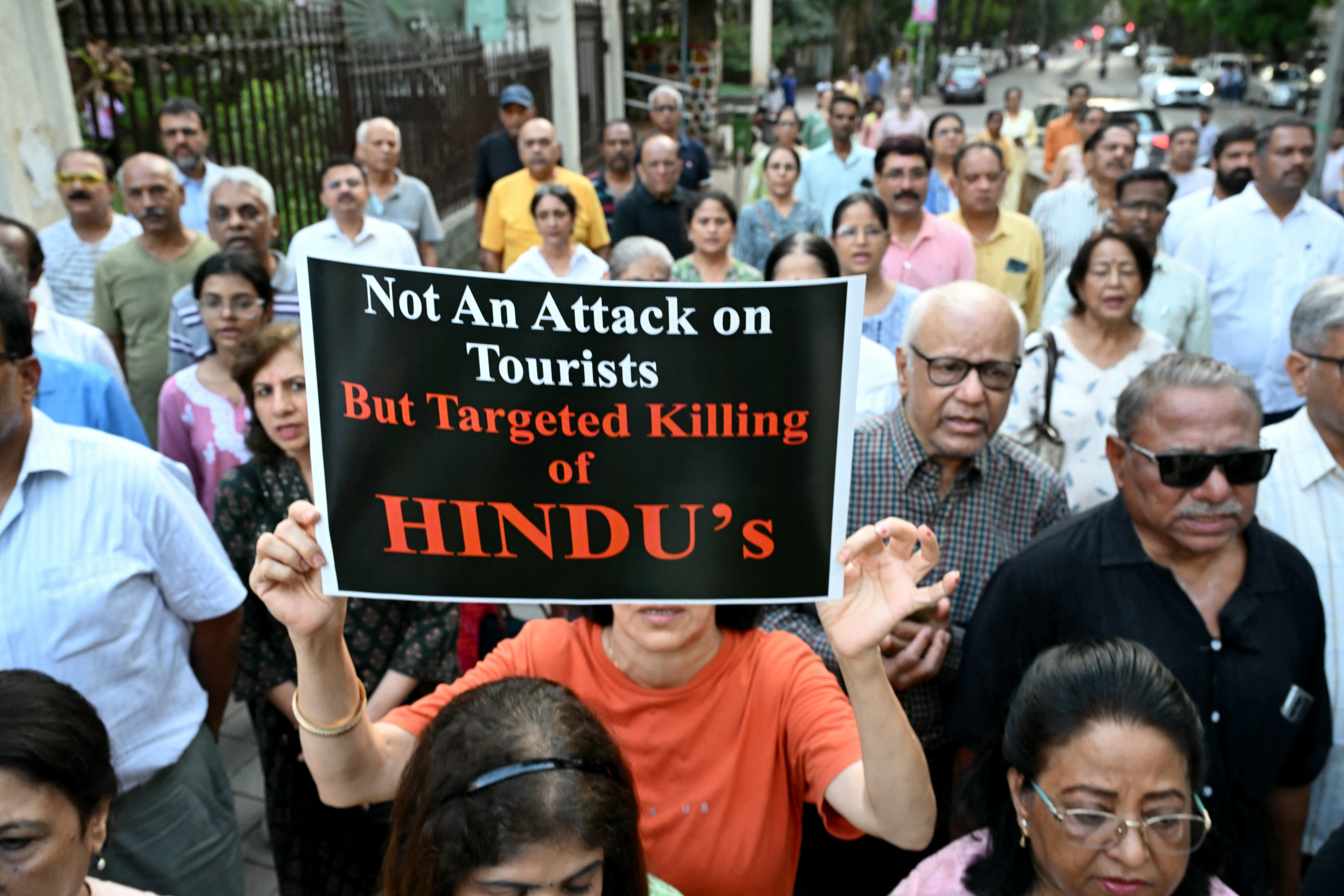 Hindus hold posters as they protest in Mumbai on April 24, 2025, to condemn the killing of tourists by gunmen in Kashmir's Pahalgam.