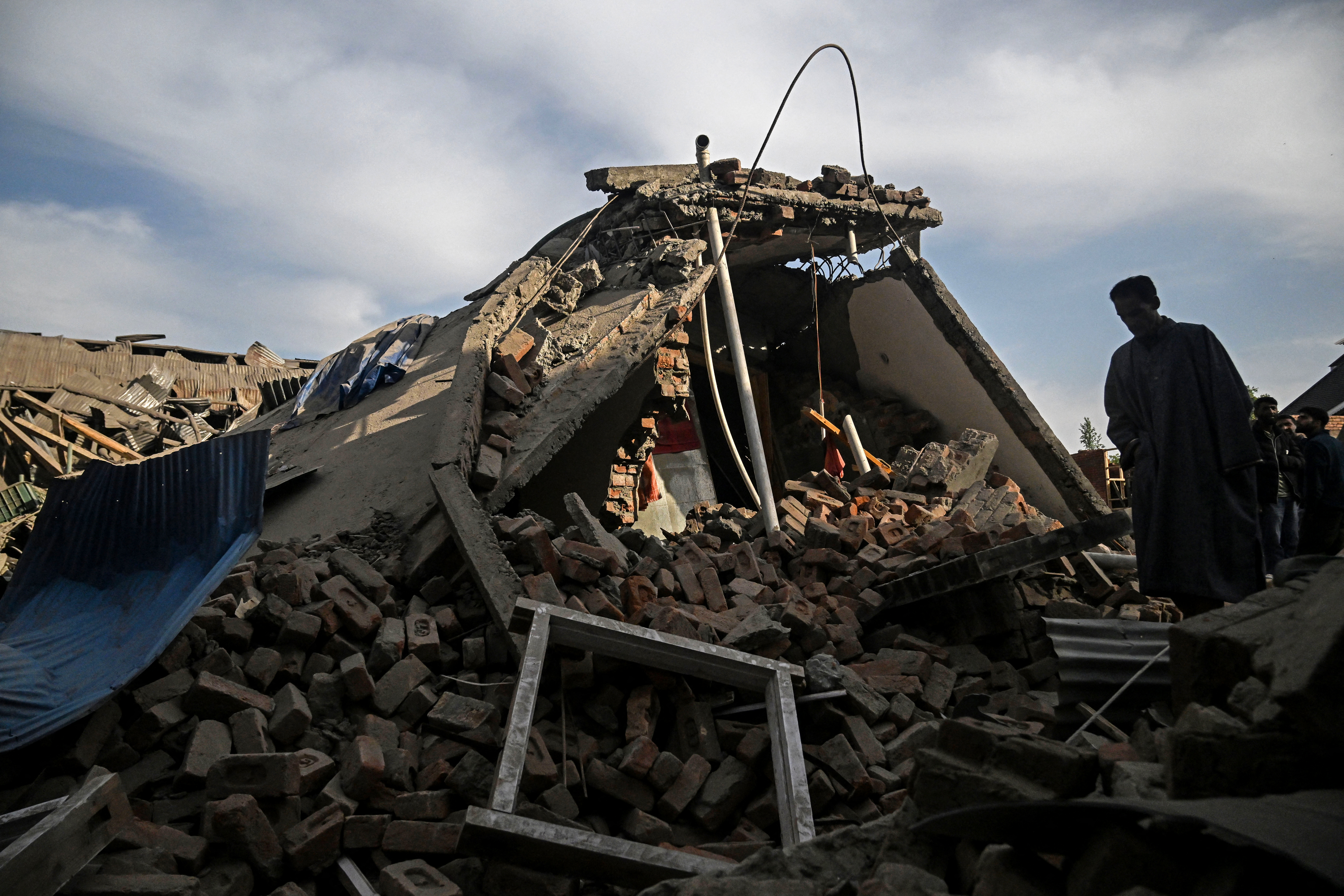 Homes destroyed in Kashmir after deadly attack sparks manhunt