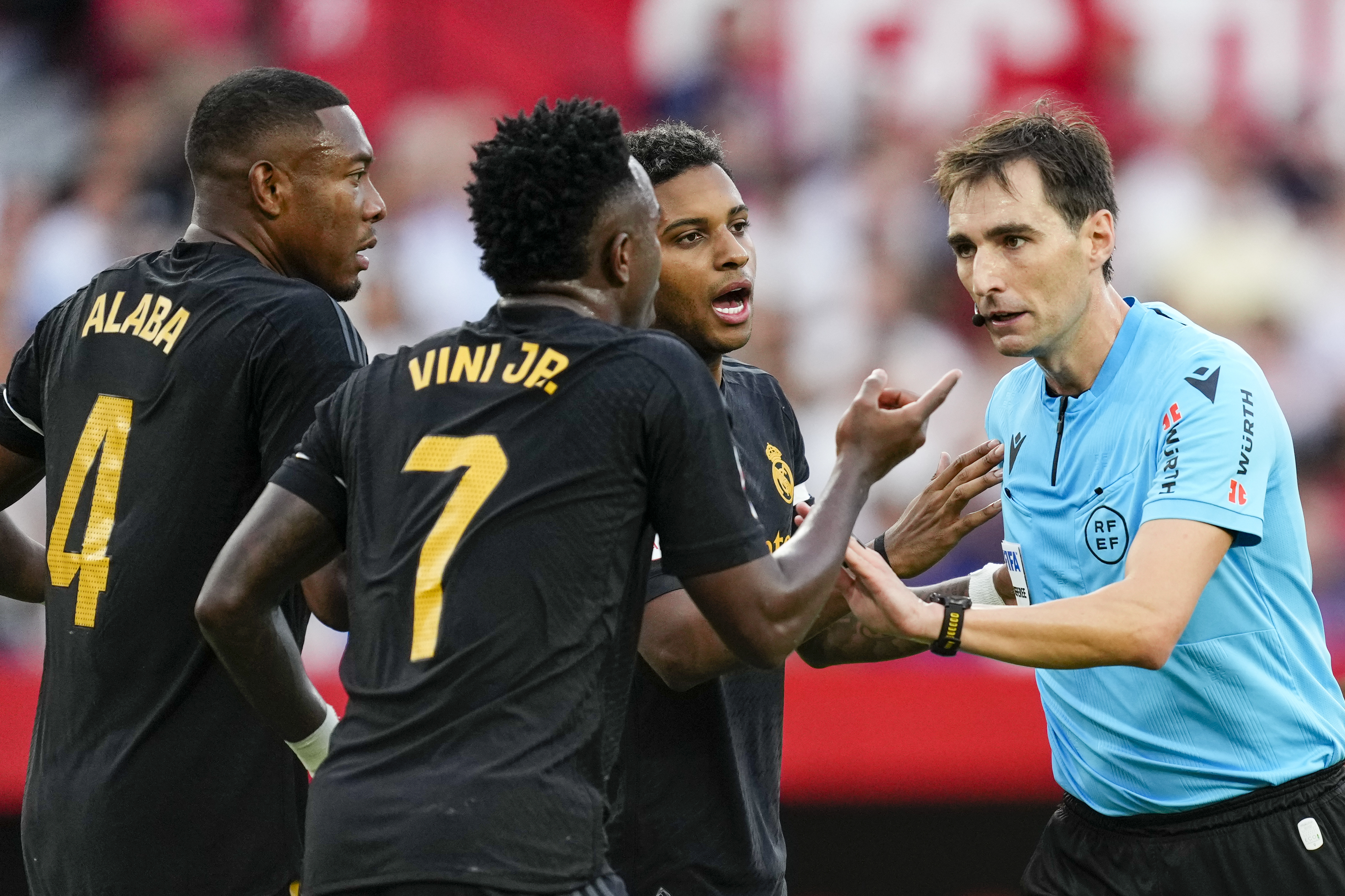Referee Ricardo De Burgos Bengoetxea, right, discusses with Real Madrid players during a match.