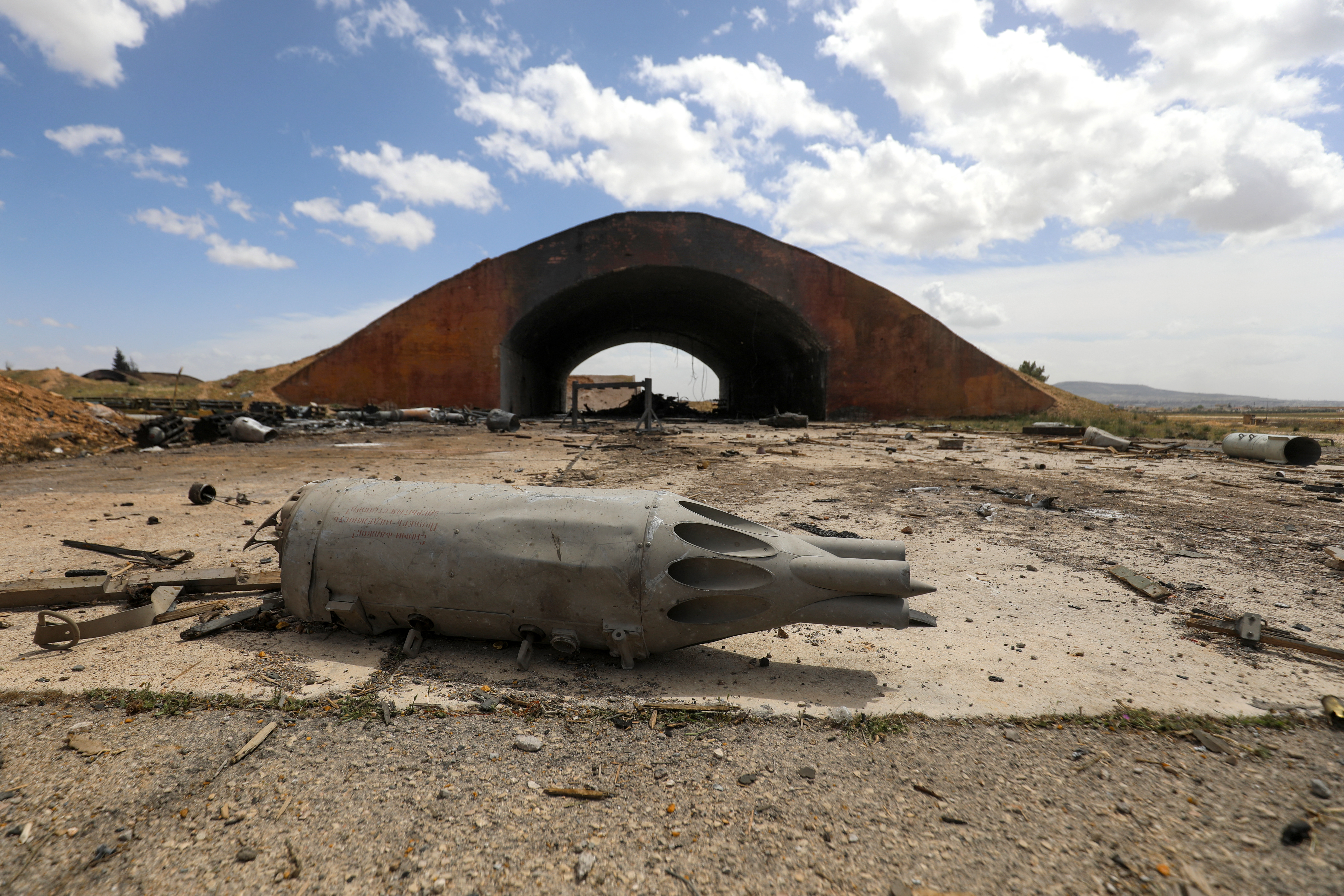 Debris lie on the ground at the scene of an Israeli strike in a military facility in Syria's southern Hama governorate, on April 3, 2025.