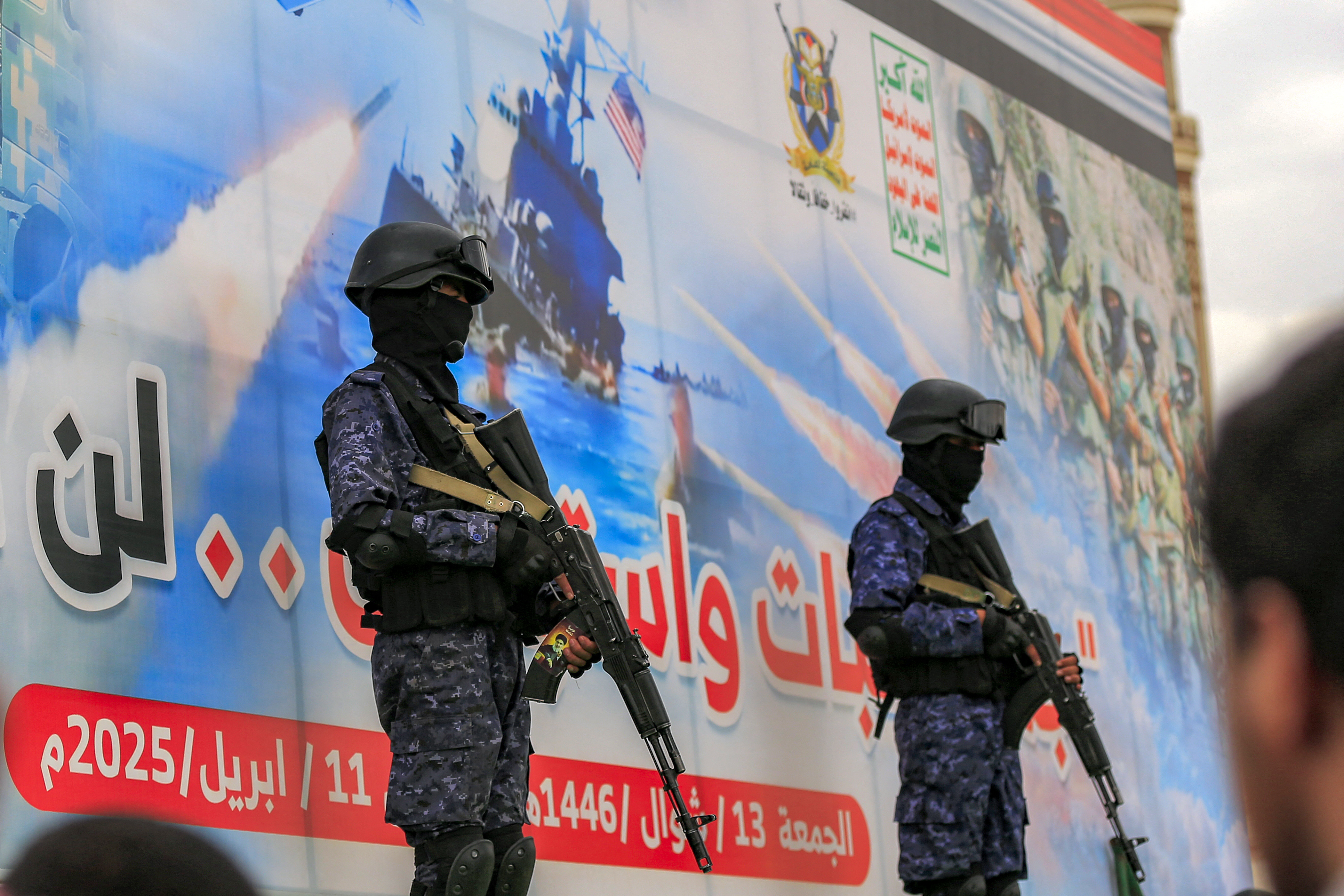 Members of Huthi-affiliated security forces stand guard during a rally in solidarity with Palestinians in the Gaza Strip and in condemnation of US strikes, in Yemen's Huthi-controlled capital Sanaa on April 11, 2025.