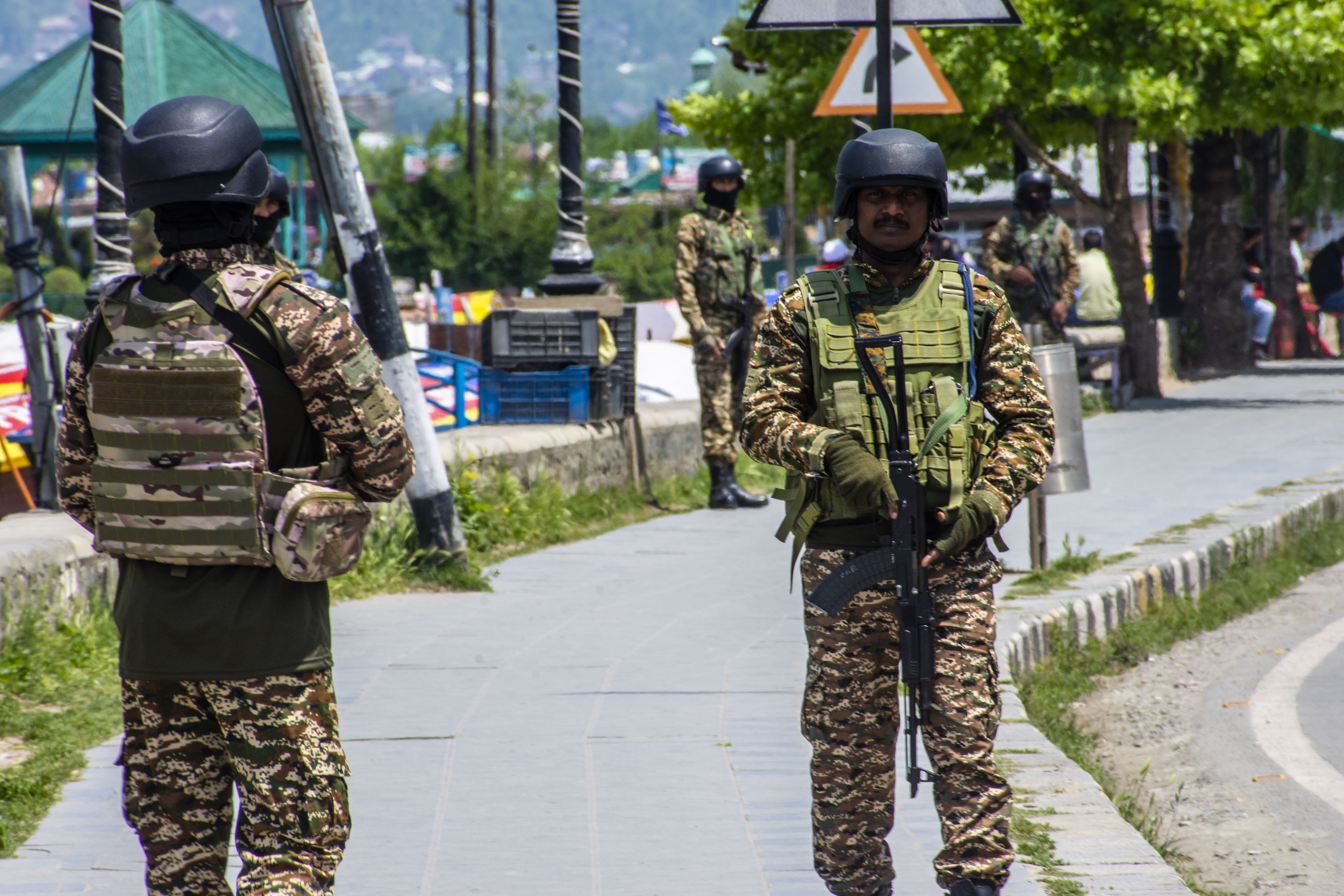 Indian soldiers stand guard on the bank of Dal Lake