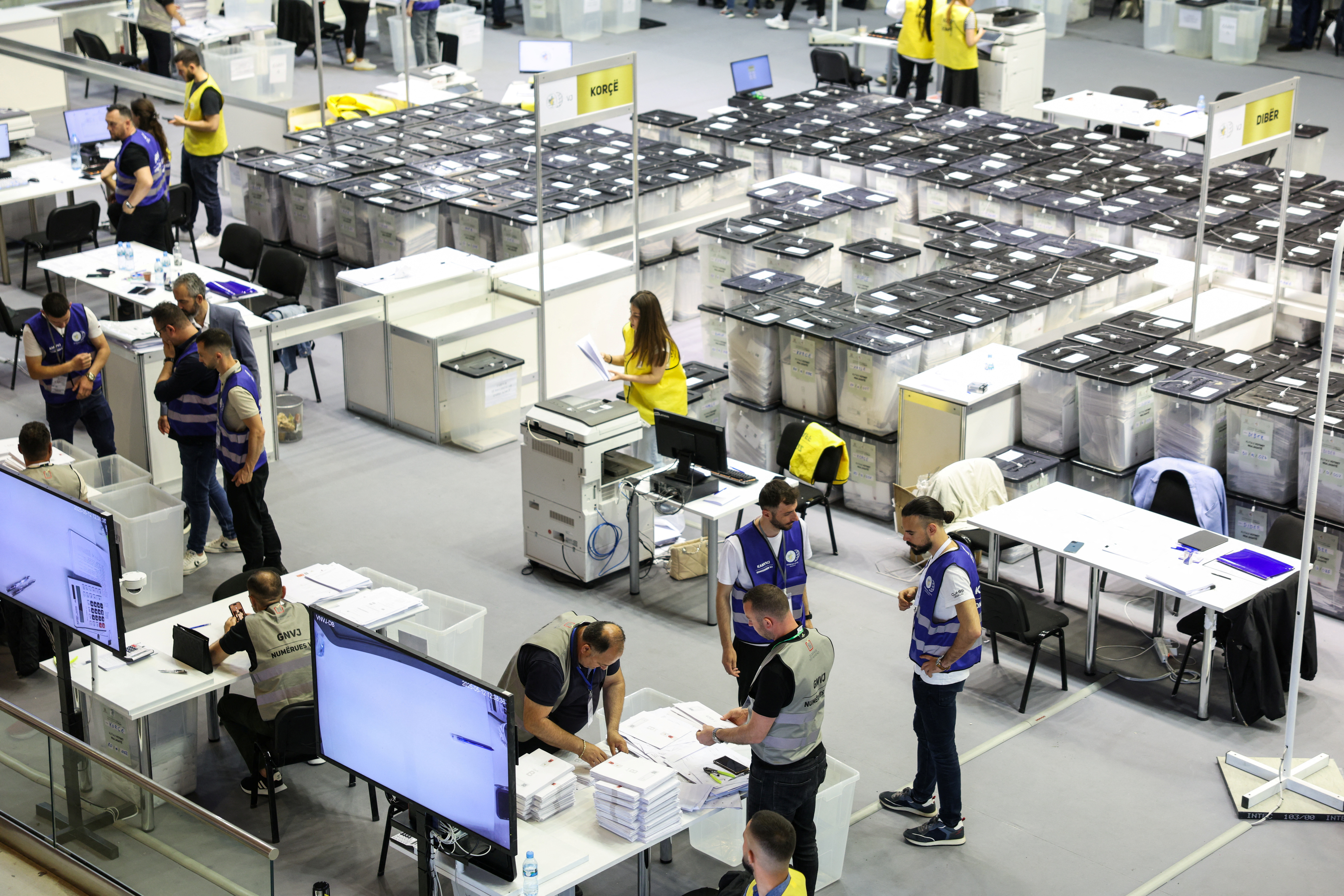 Officials count ballots in a counting center, after Sunday’s parliamentary election in Tirana