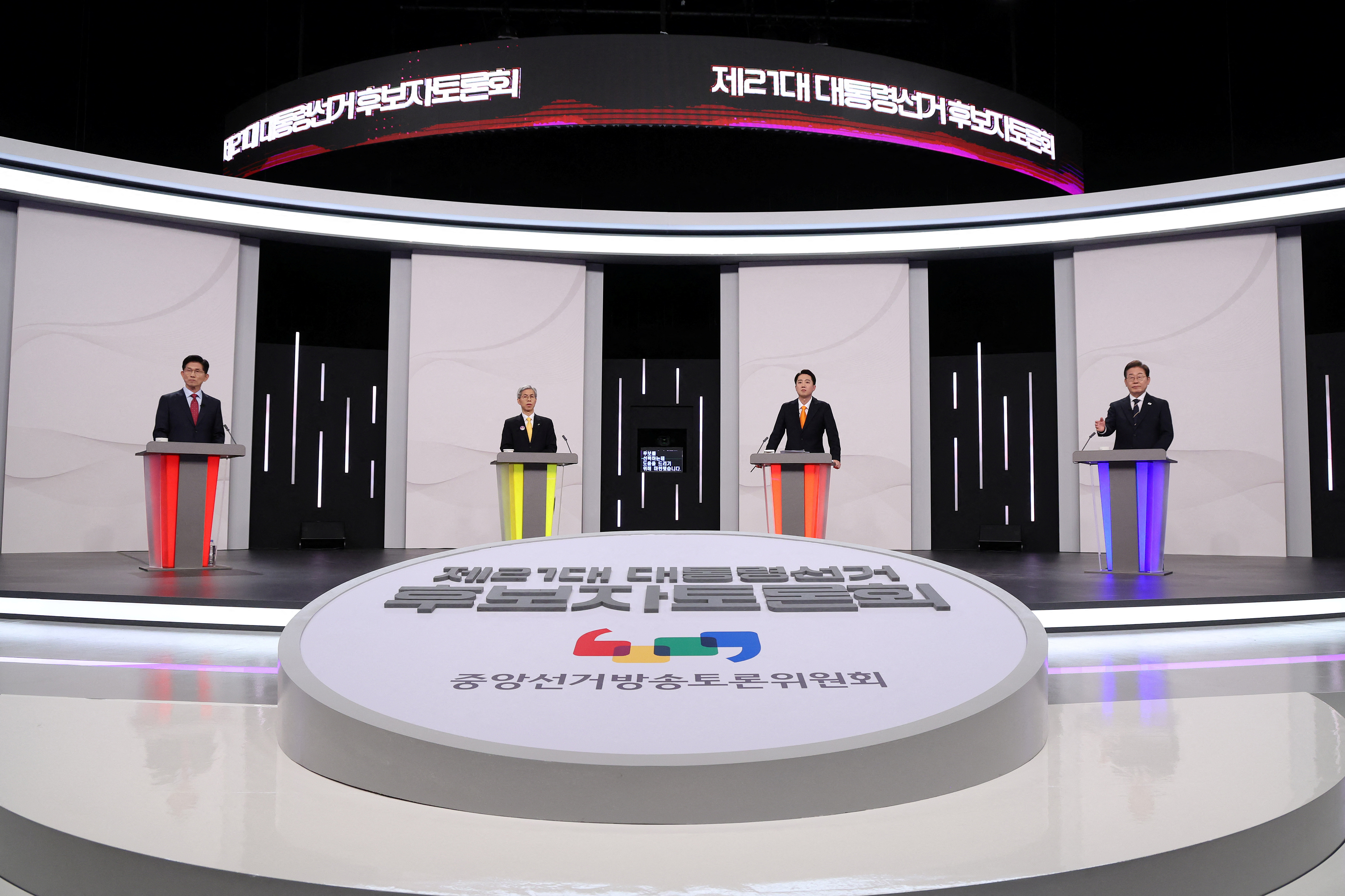 South Korea's presidential candidates, Kim Moon Soo of the People Power Party, Kwon Young-guk of the Democratic Labor Party, Lee Jun-seok of the New Reform Party and Lee Jae-myung of the Democratic Party pose for photograph ahead of a televised presidential debate for the forthcoming June 3 presidential election at SBS studio on May 18, 2025 in Seoul, South Korea. Chung Sung-Jun/Pool via REUTERS