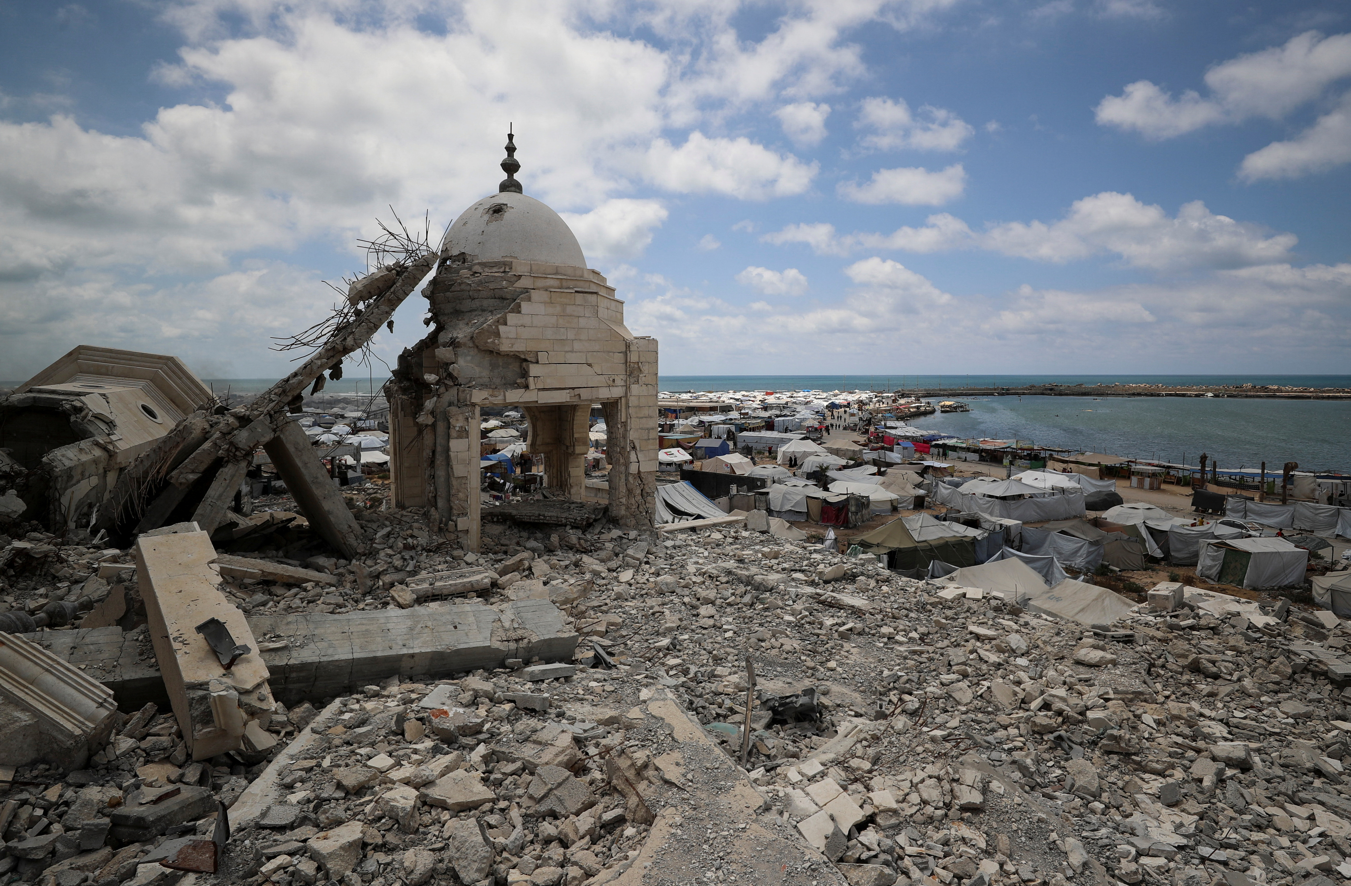 A view from the ruins of a mosque shows tents used by Palestinians displaced by the Israeli military.
