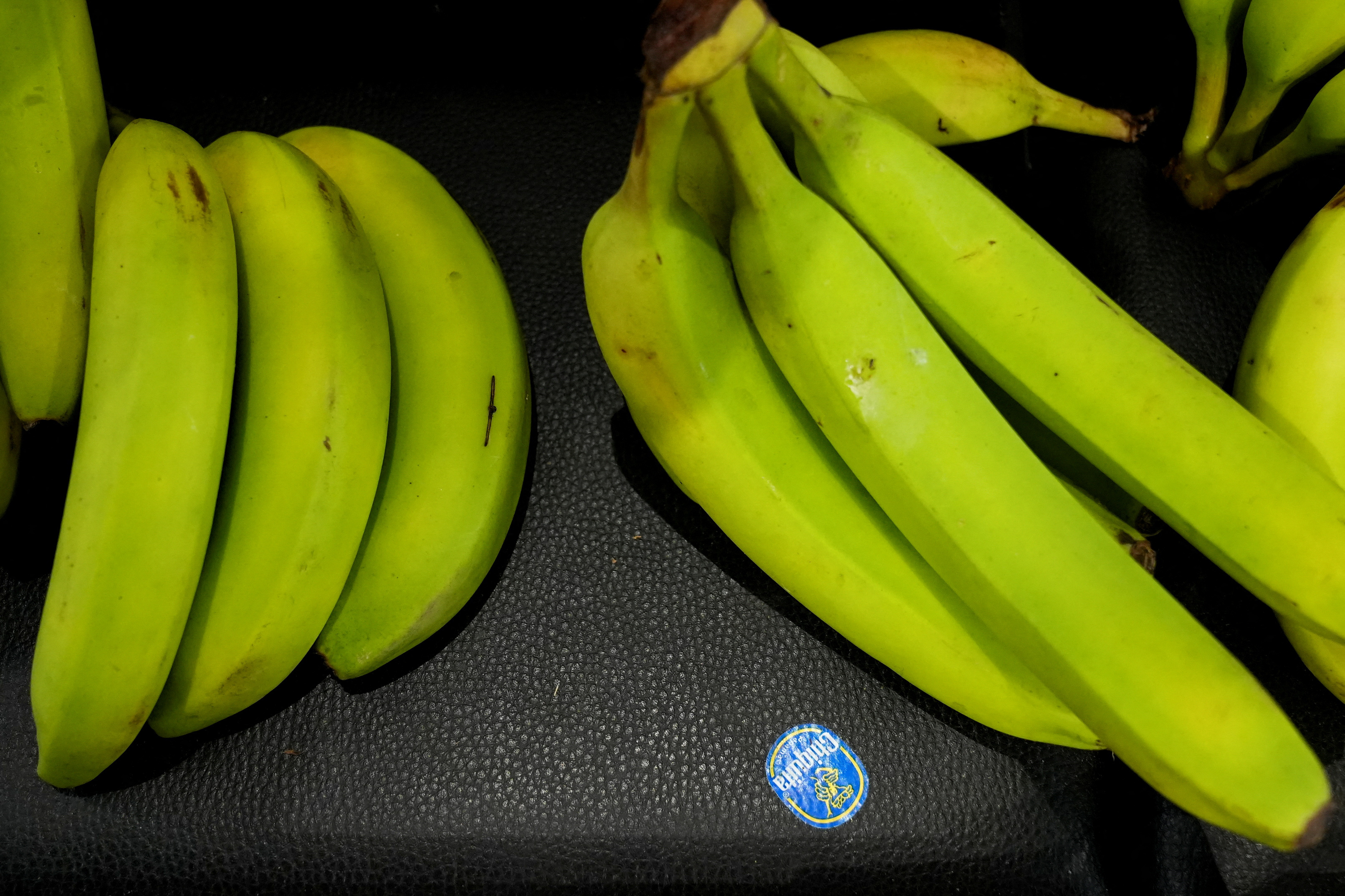 Bananas are displayed at a store.