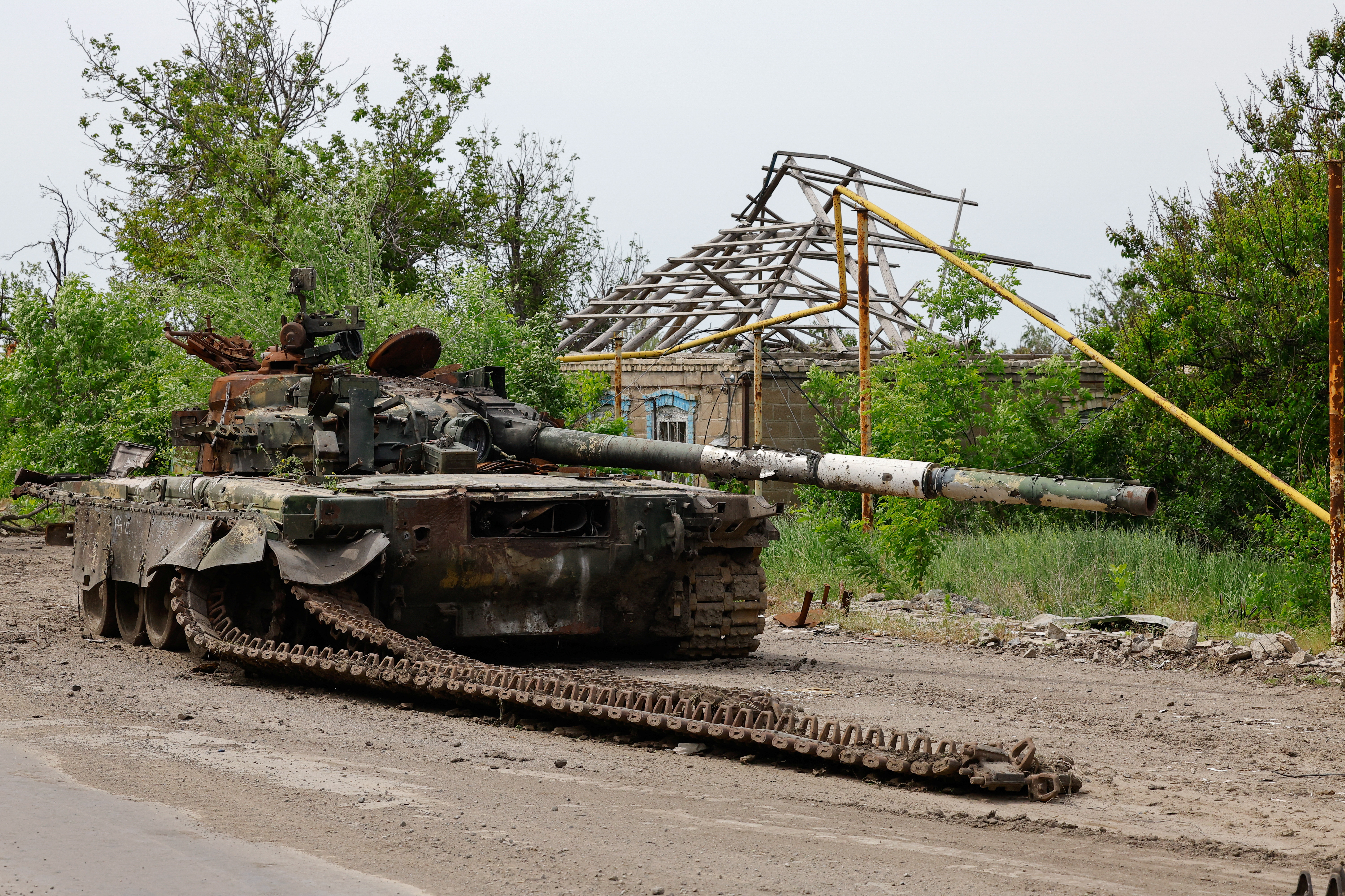 A view shows an abandoned tank, which was destroyed in the course of Russia-Ukraine conflict in the village of Mykilske (Nikolskoye) near Vuhledar (Ugledar) city in the Donetsk region, a Russian-controlled area of Ukraine, May 27, 2025. REUTERS/Alexander Ermochenko