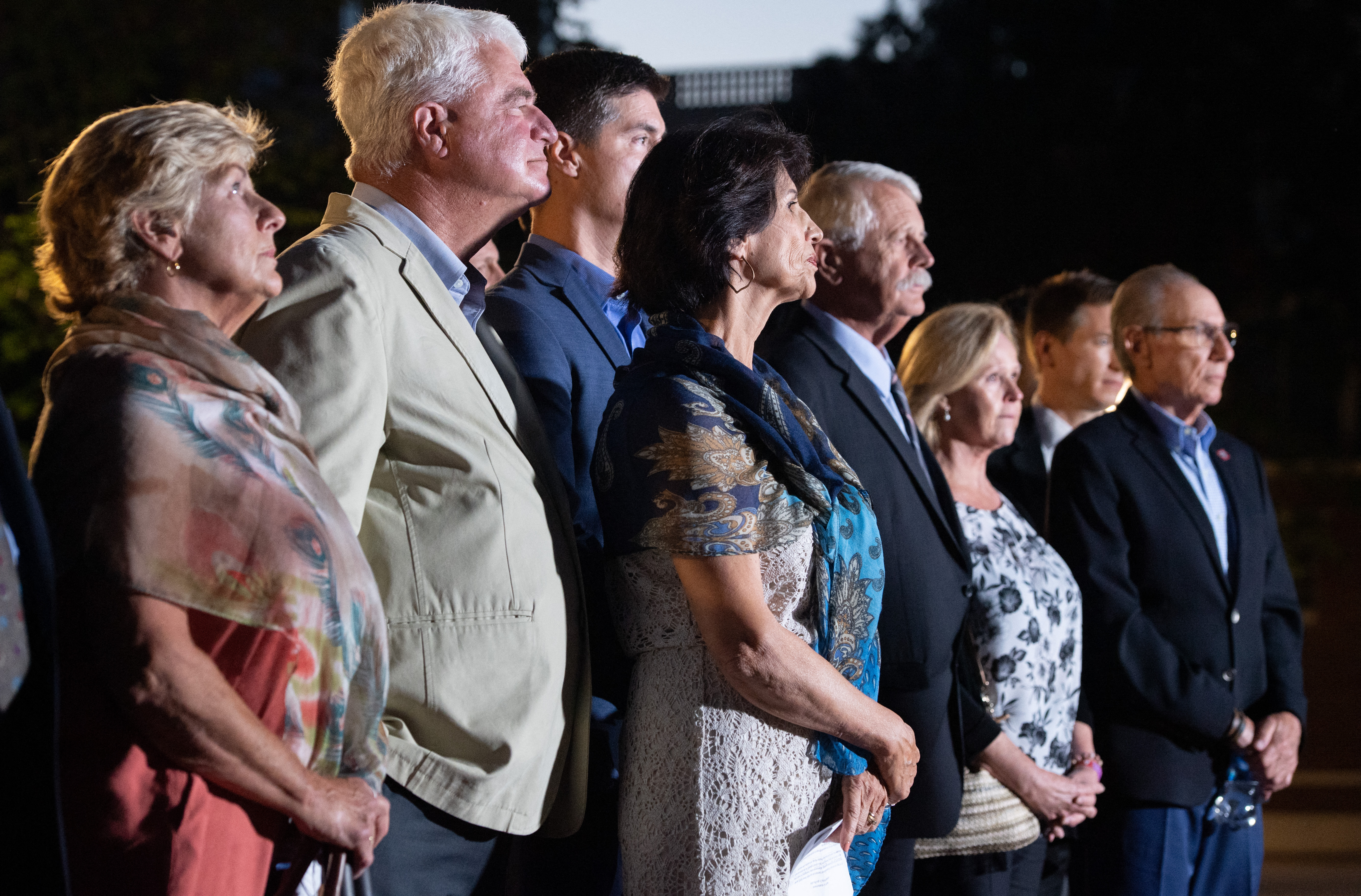 Diane Foley, the mother of slain ISIS hostage James Foley (C), stands alongside the parents of slain ISIS hostage Kayla Mueller, Carl Mueller (3rd R) and Marsha Mueller (2nd R), and family members of 2 other slain ISIS hostages outside the the US District Court in Alexandria, Virginia on September 2, 2021.