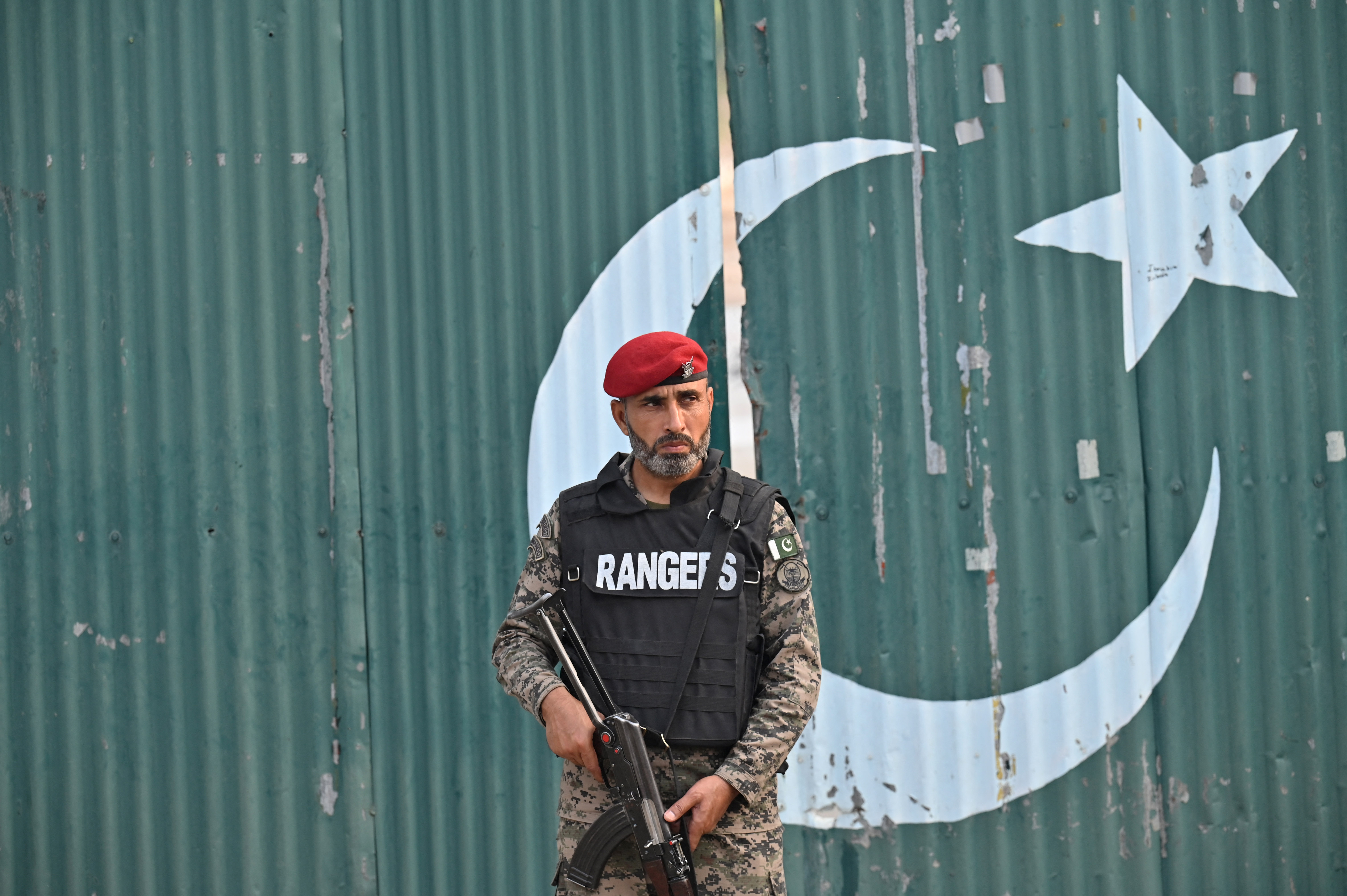 A paramilitary soldier stands guard outside a government complex after Indian missile attacks in Muridke