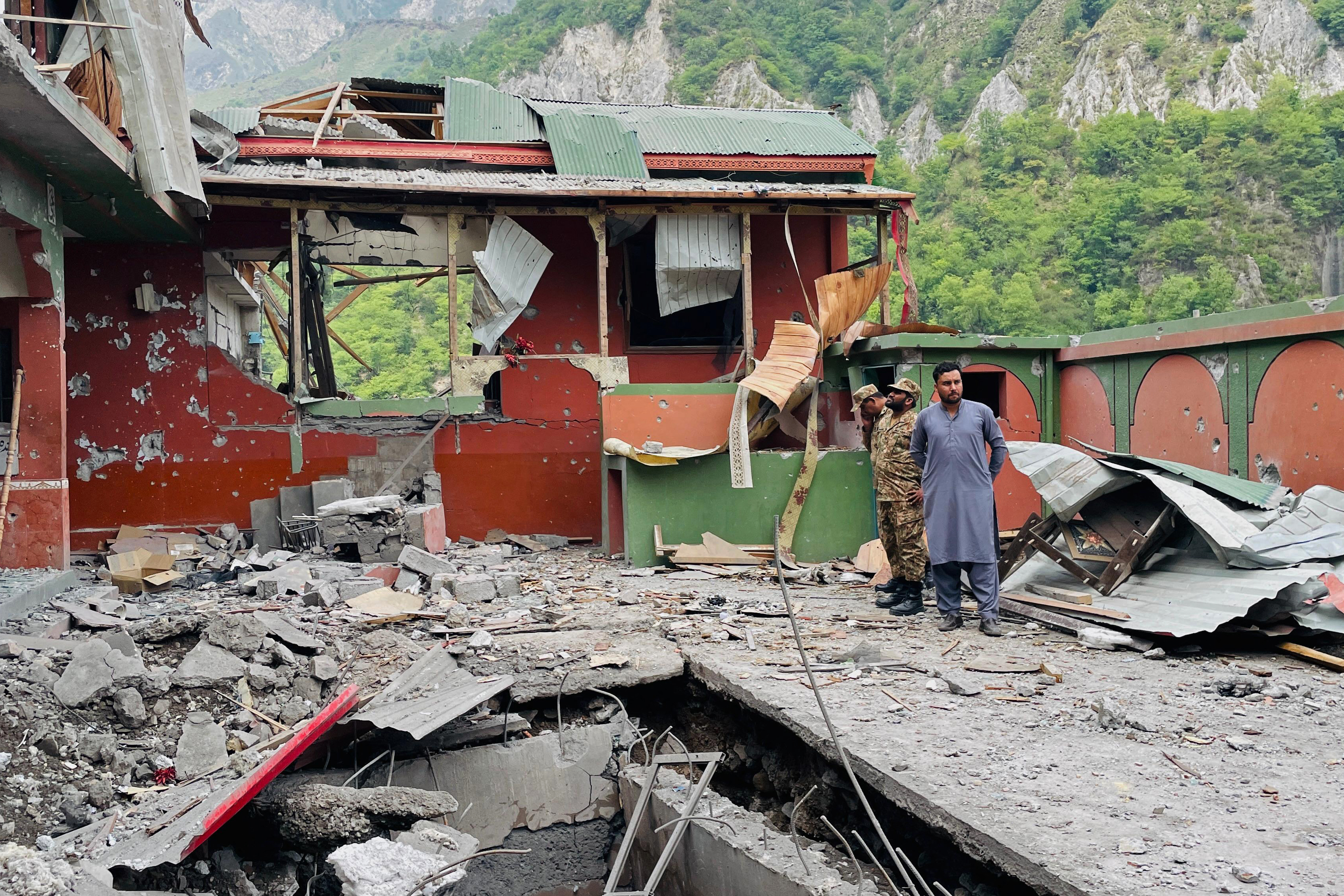Soldiers inspect the debris of a mosque after Indian strikes in Muzaffarabad, the capital of Pakistan-administered Kashmir, on May 7, 2025.
