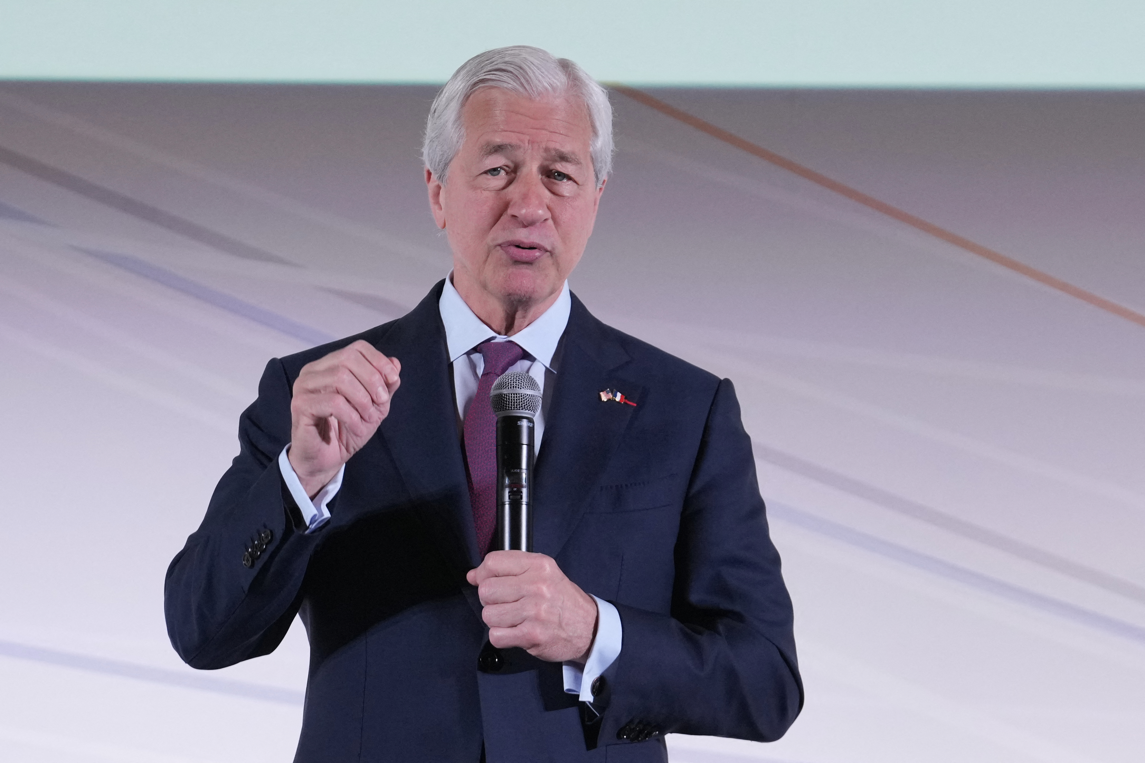 JPMorgan Chase CEO Jamie Dimon delivers a speech during the Global Markets Conference, ahead of the Choose France summit, in Paris, on May 15, 2025. The eighth edition of the Choose France summit, aimed at attracting major foreign investment to France, to be held in Versailles on May 19, is set to be "historic" once again, according to the Elysee Palace. (Photo by Michel Euler / POOL / AFP)
