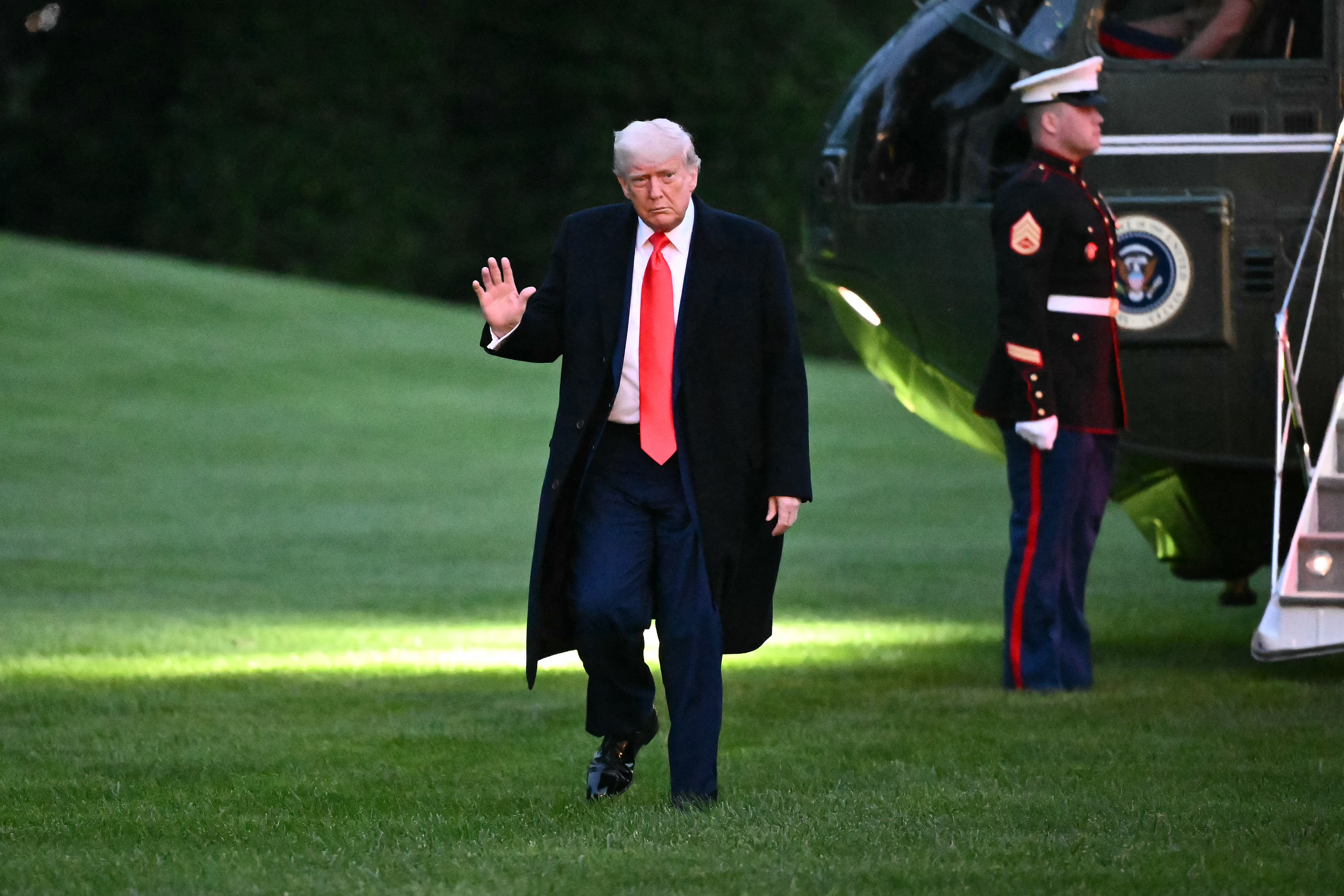 US President Donald Trump steps off Marine One on the South Lawn of the White House in Washington, DC, on May 22, 2025. Trump attended a private dinner at Trump National Golf Club. (Photo by Mandel NGAN / AFP)