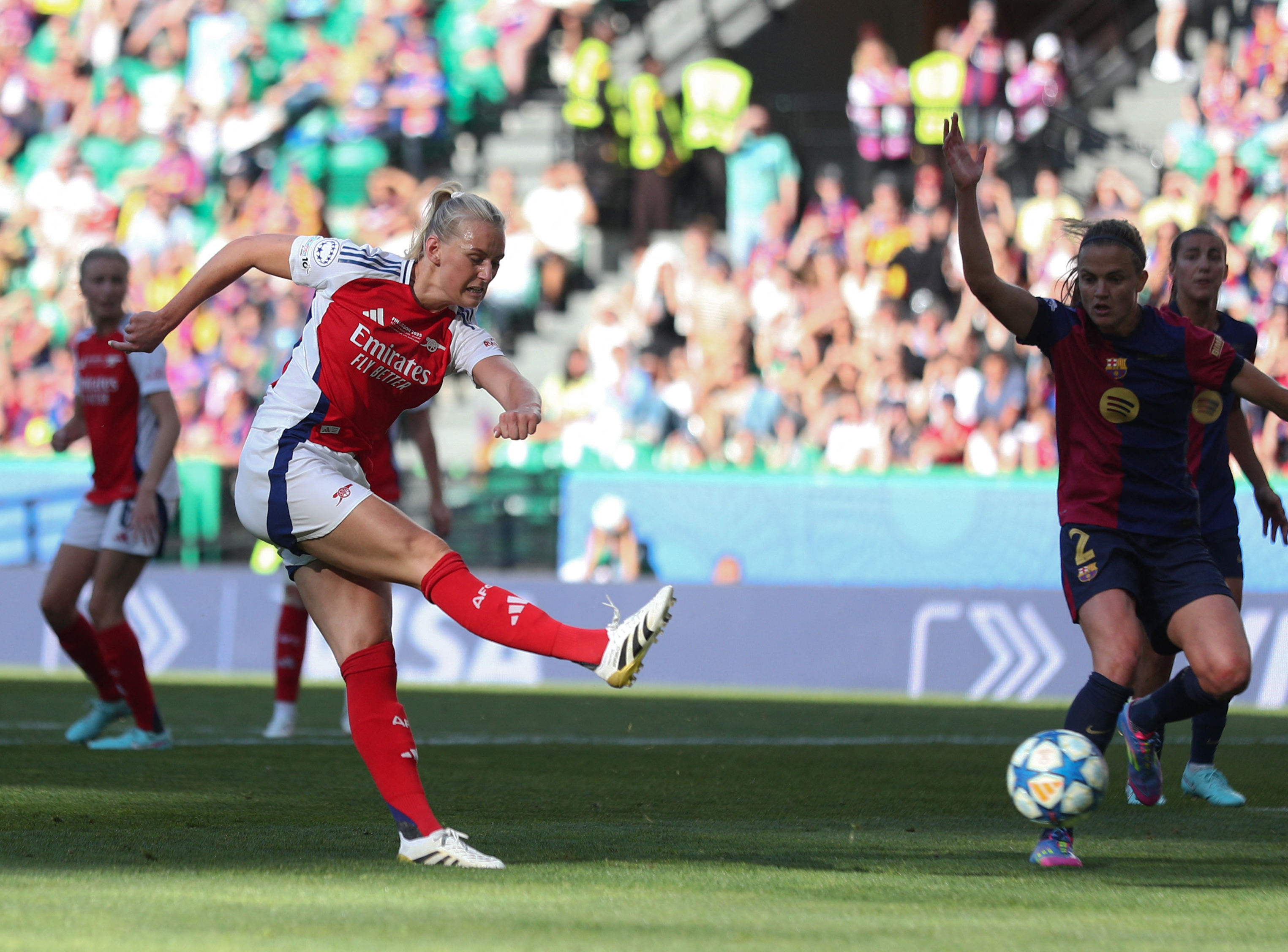Arsenal's Swedish striker #25 Stina Blackstenius kicks the ball and scores her team's first goal during the UEFA Women's Champions League final