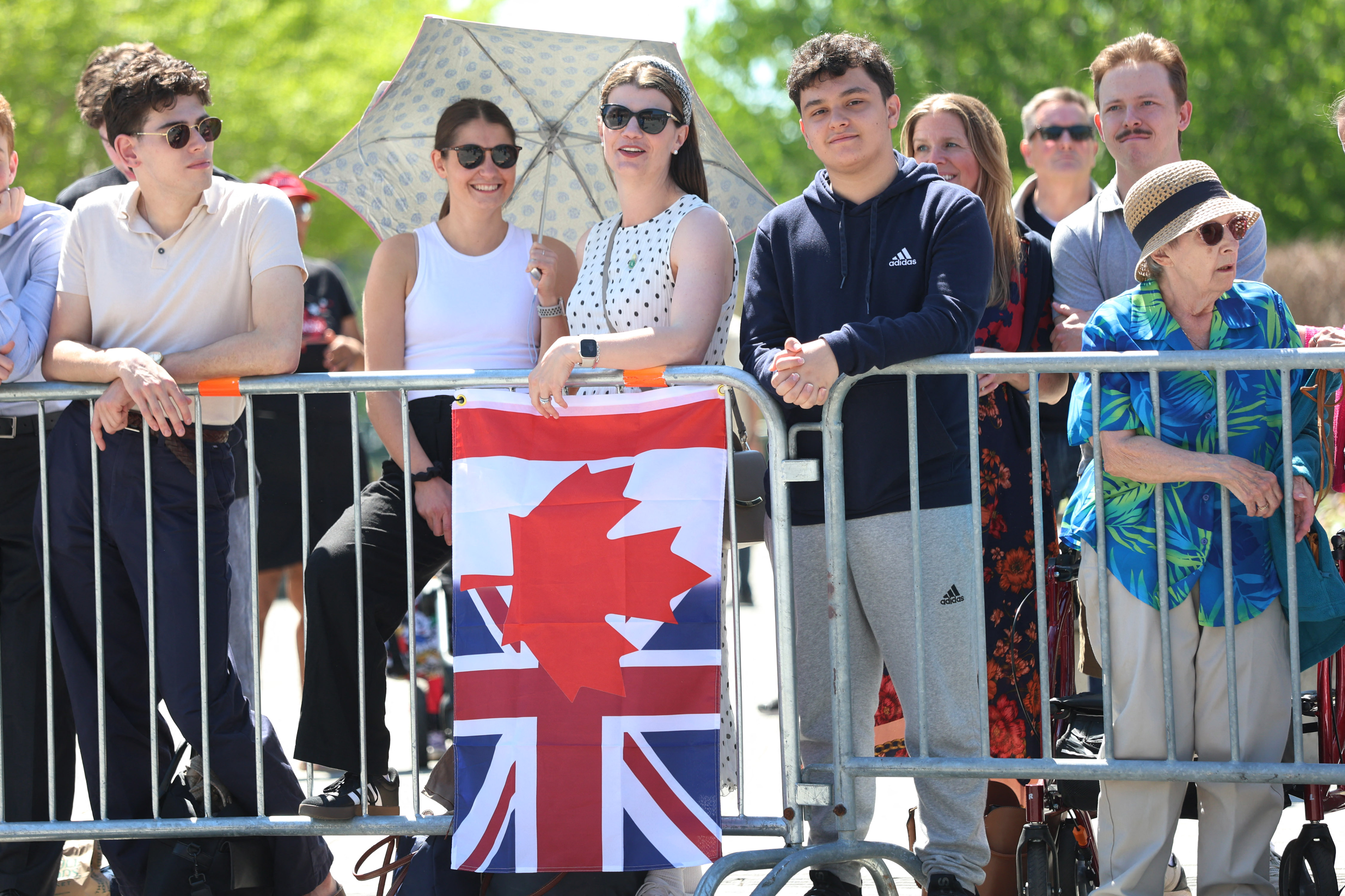 people hold flag of Canada and UK