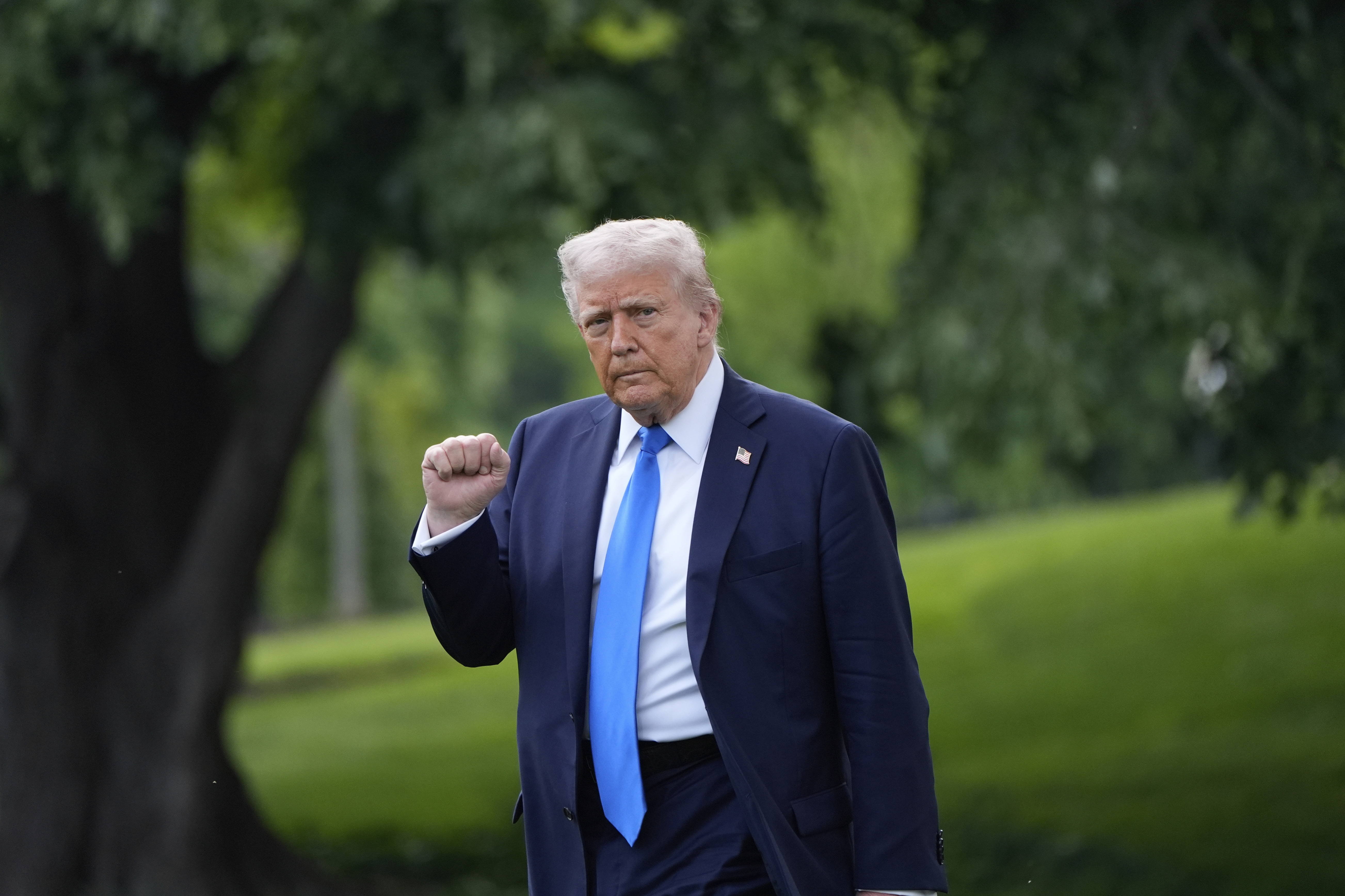President Donald Trump gestures as he walks from the Oval Office to depart on Marine One from the South Lawn of the White House, Thursday, May 1, 2025, in Washington. (AP Photo/Alex Brandon)