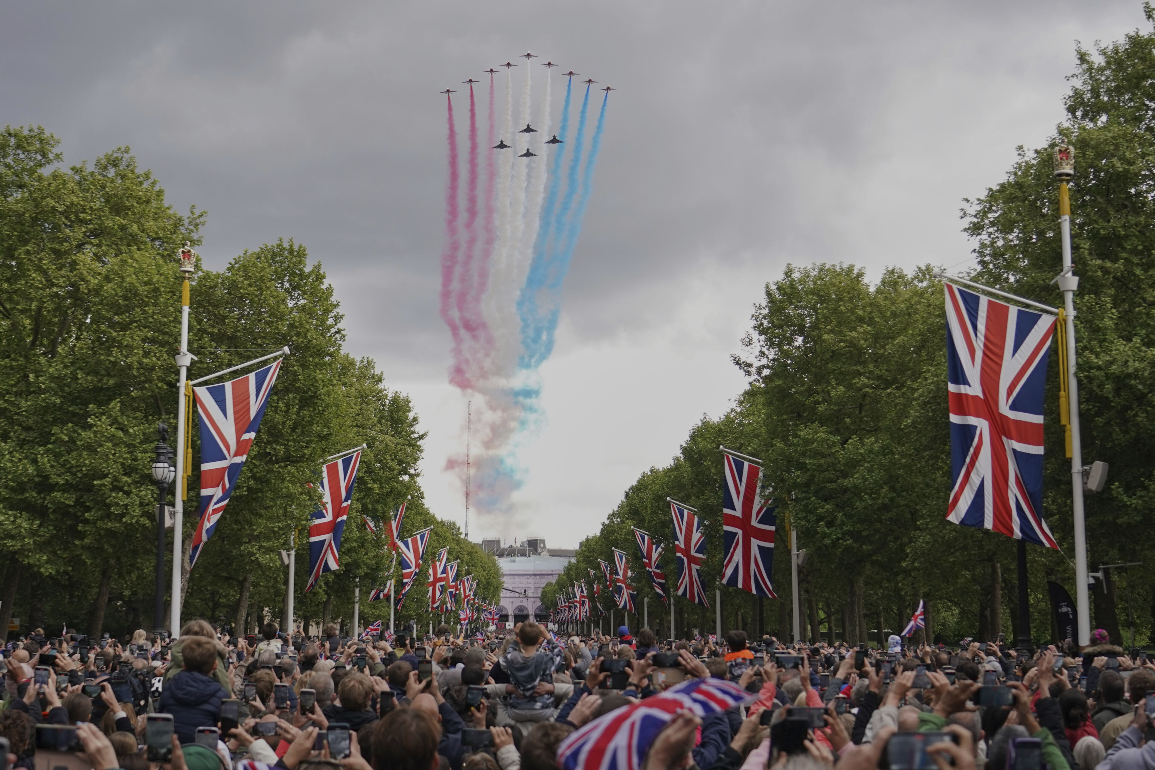 The Red Arrows the Royal Airforce display team, fly over the Mall and Buckingham Palace during the V-E Day 80th anniversary parade in London