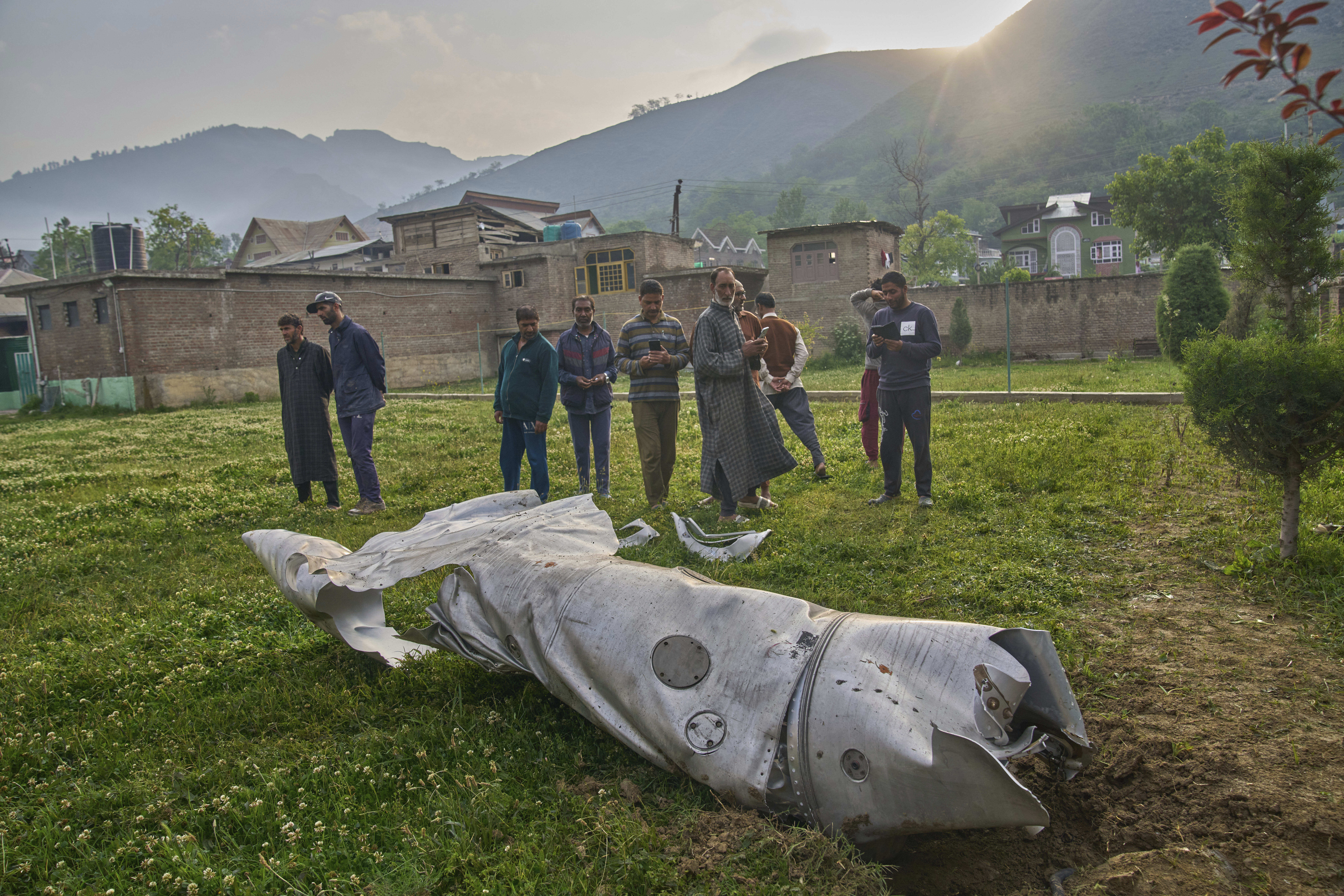 Debris of an aircraft lies in the compound of a mosque.