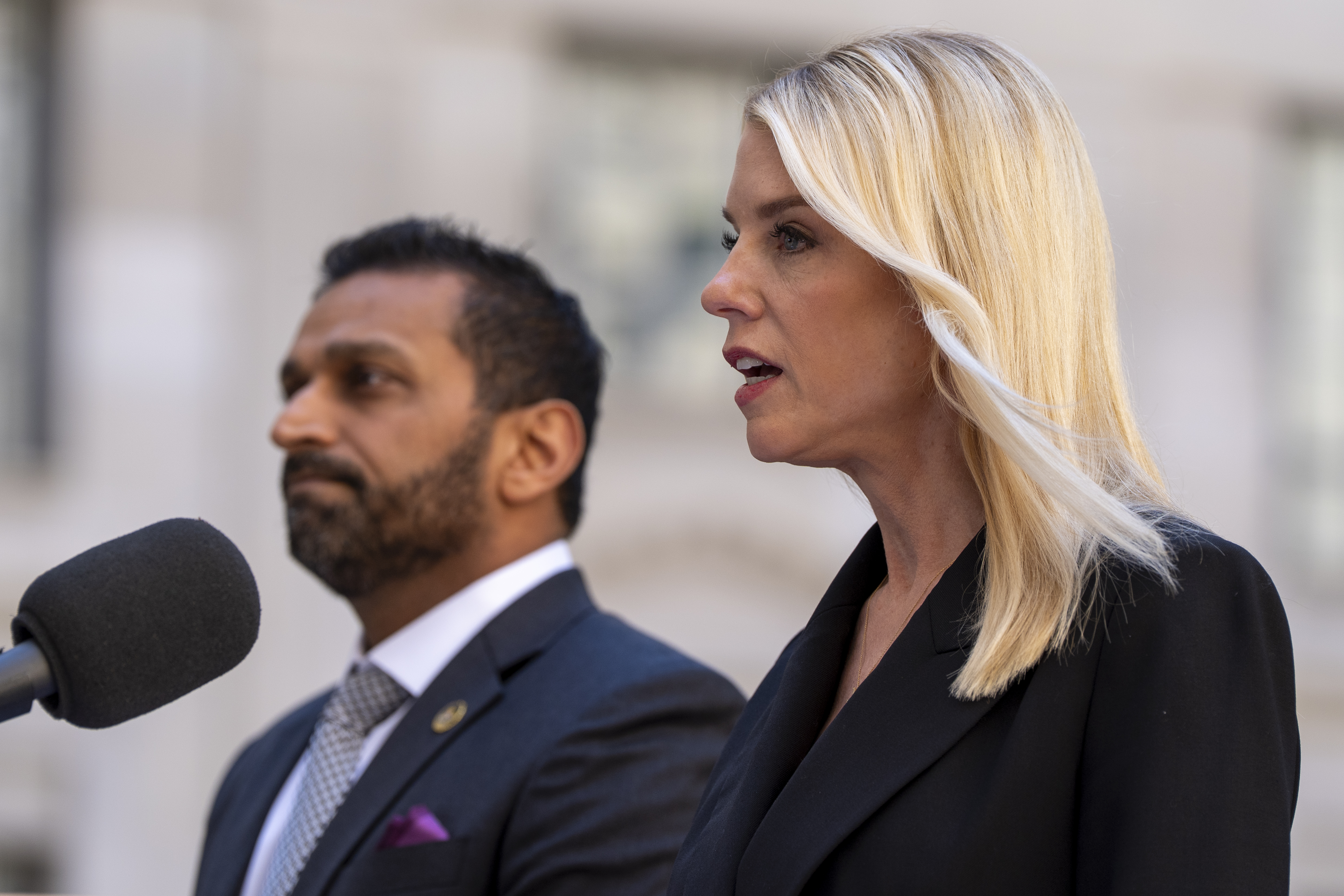 Kash Patel and Pam Bondi at a press conference.