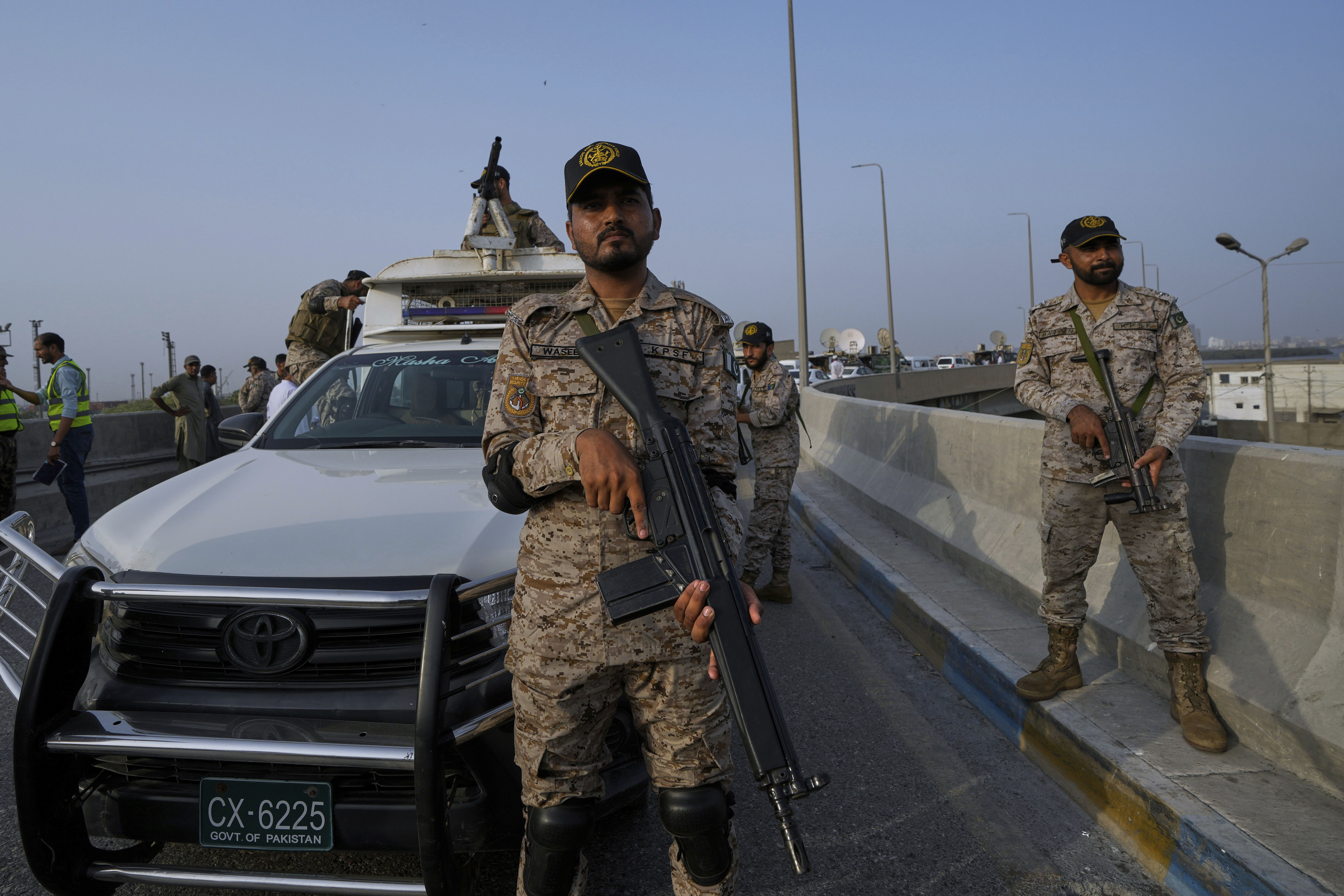 A paramilitary soldier stand alert on a road near Karachi port