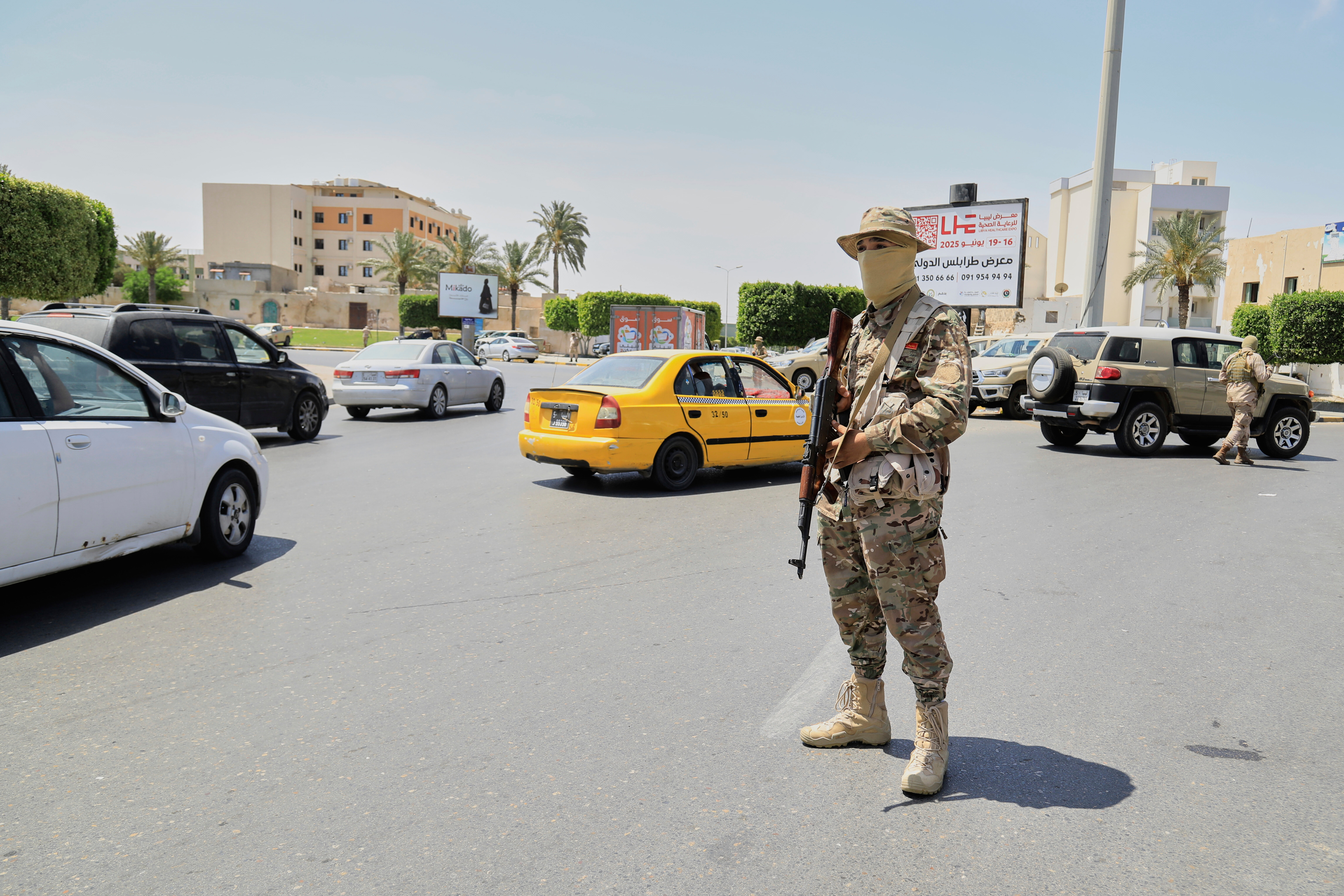 A Libyan soldier stands on alert at a checkpoint in Tripoli, Libya, Tuesday, May 13, 2025. [File: Yousef Murad/AP)