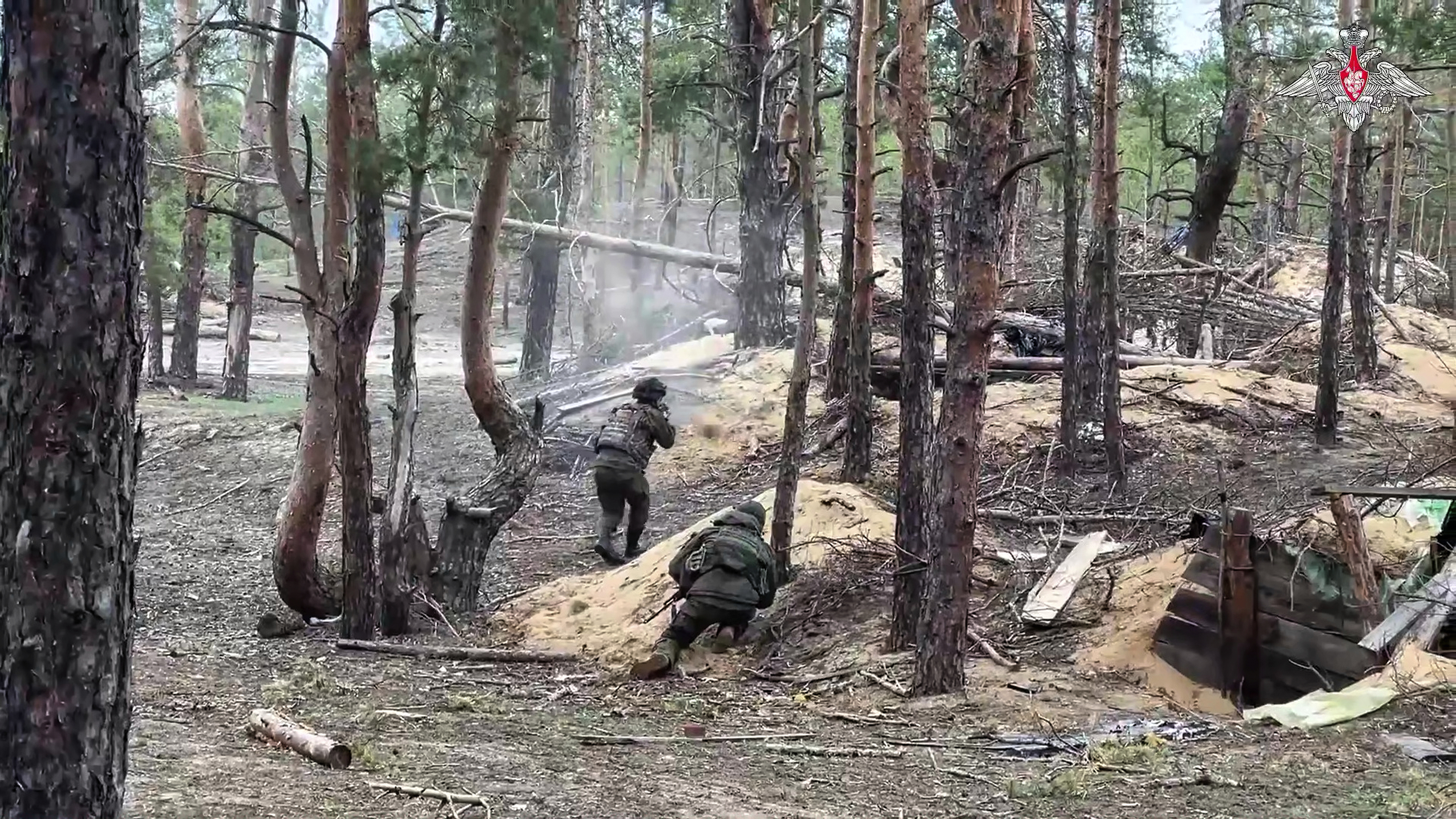 In this photo taken from video distributed by Russian Defense Ministry Press Service on Wednesday, May 21, 2025, Russian servicemen attend a combat training for assault units in an undisclosed location in Ukraine. (Russian Defense Ministry Press Service via AP)