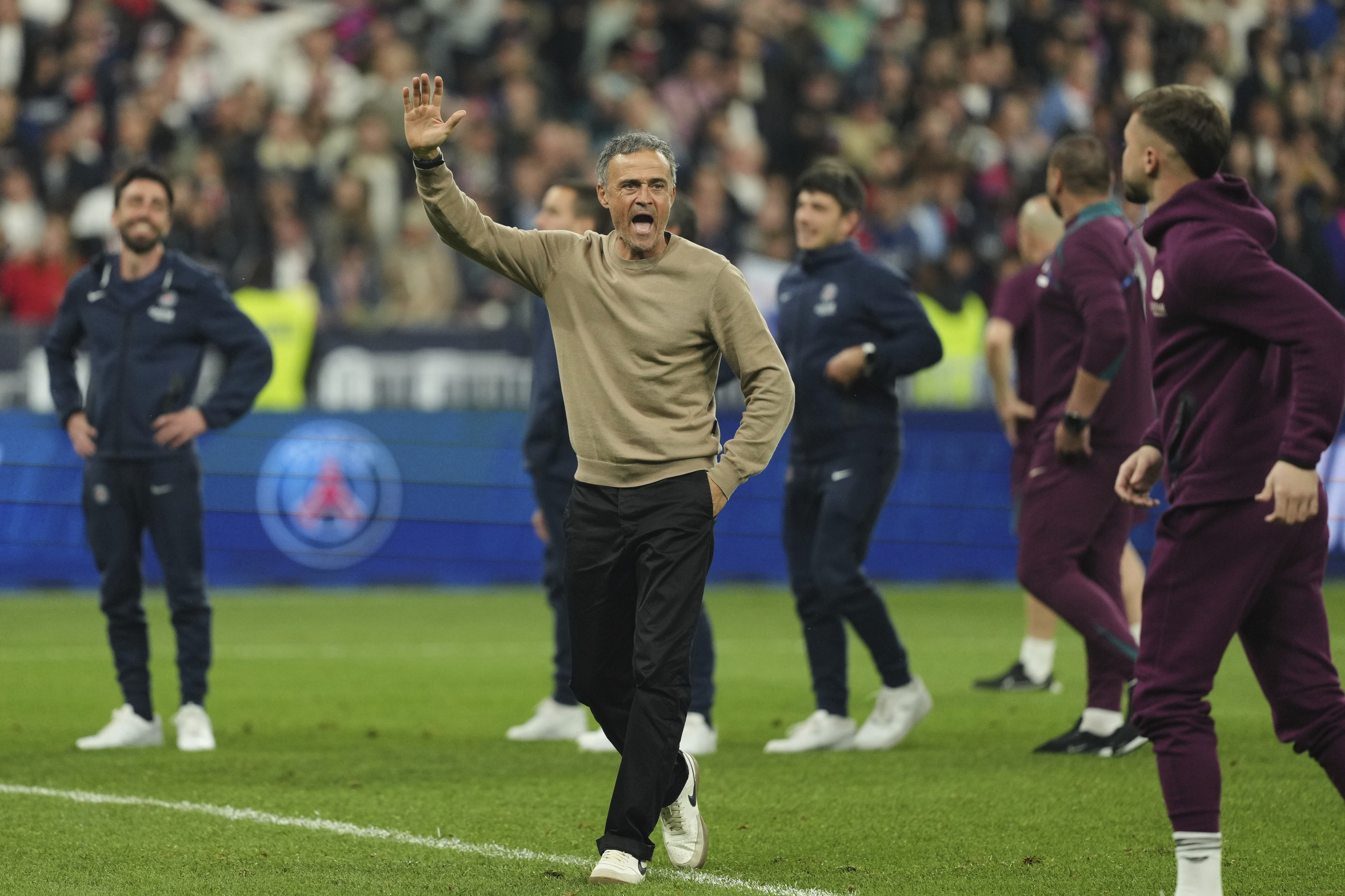 PSG's head coach Luis Enrique, centre, celebrates at the end of the French Cup soccer final