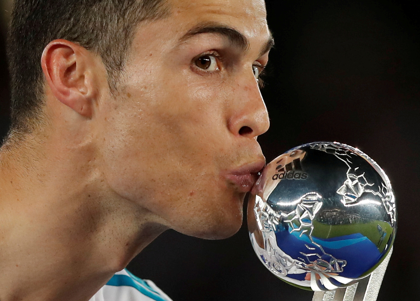 Soccer Football - FIFA Club World Cup Final - Real Madrid vs Gremio FBPA - Zayed Sports City Stadium, Abu Dhabi, United Arab Emirates - December 16, 2017 Real Madrid's Cristiano Ronaldo kisses his award as he celebrates after the game REUTERS/Amr Abdallah Dalsh TPX IMAGES OF THE DAY