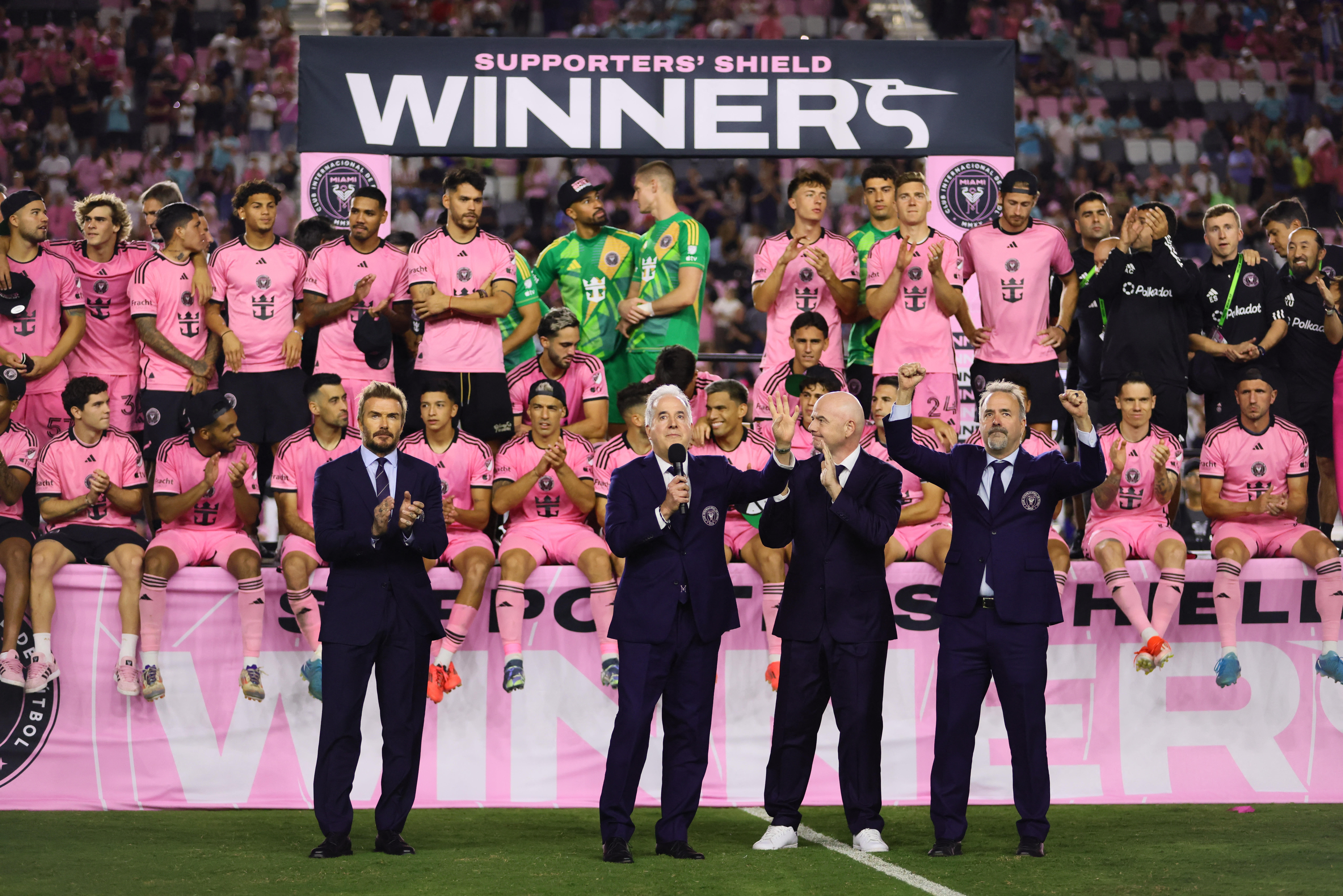  Inter Miami CF co-owner David Beckham and co-owner Jorge Mas and FIFA president Gianni Infantino and co-owner Jose Mas stand in front of the team post game against the New England Revolution 