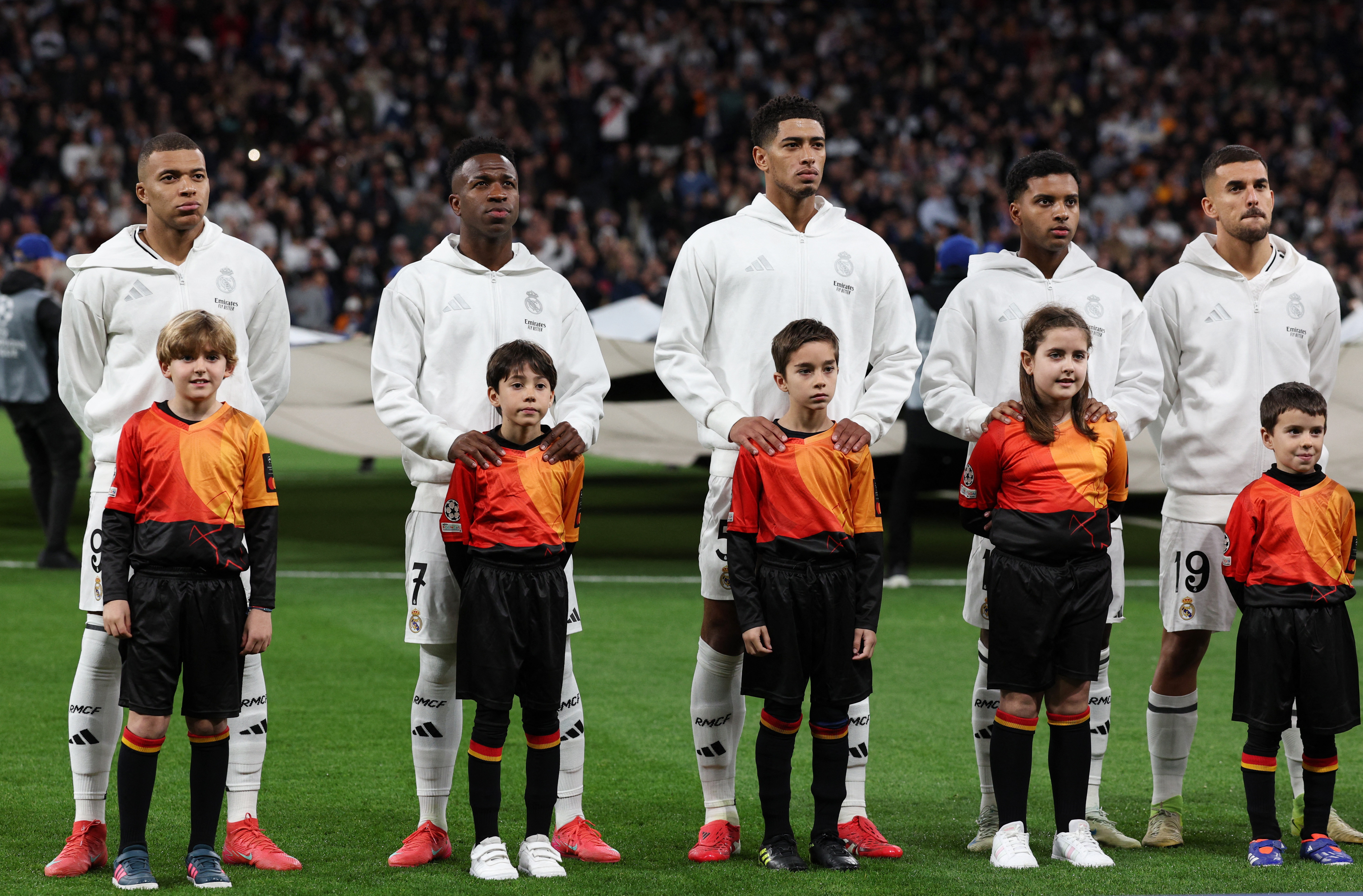 Real Madrid's Kylian Mbappe, Vinicius Junior, Jude Bellingham, Rodrygo and Dani Ceballos line up before the match 