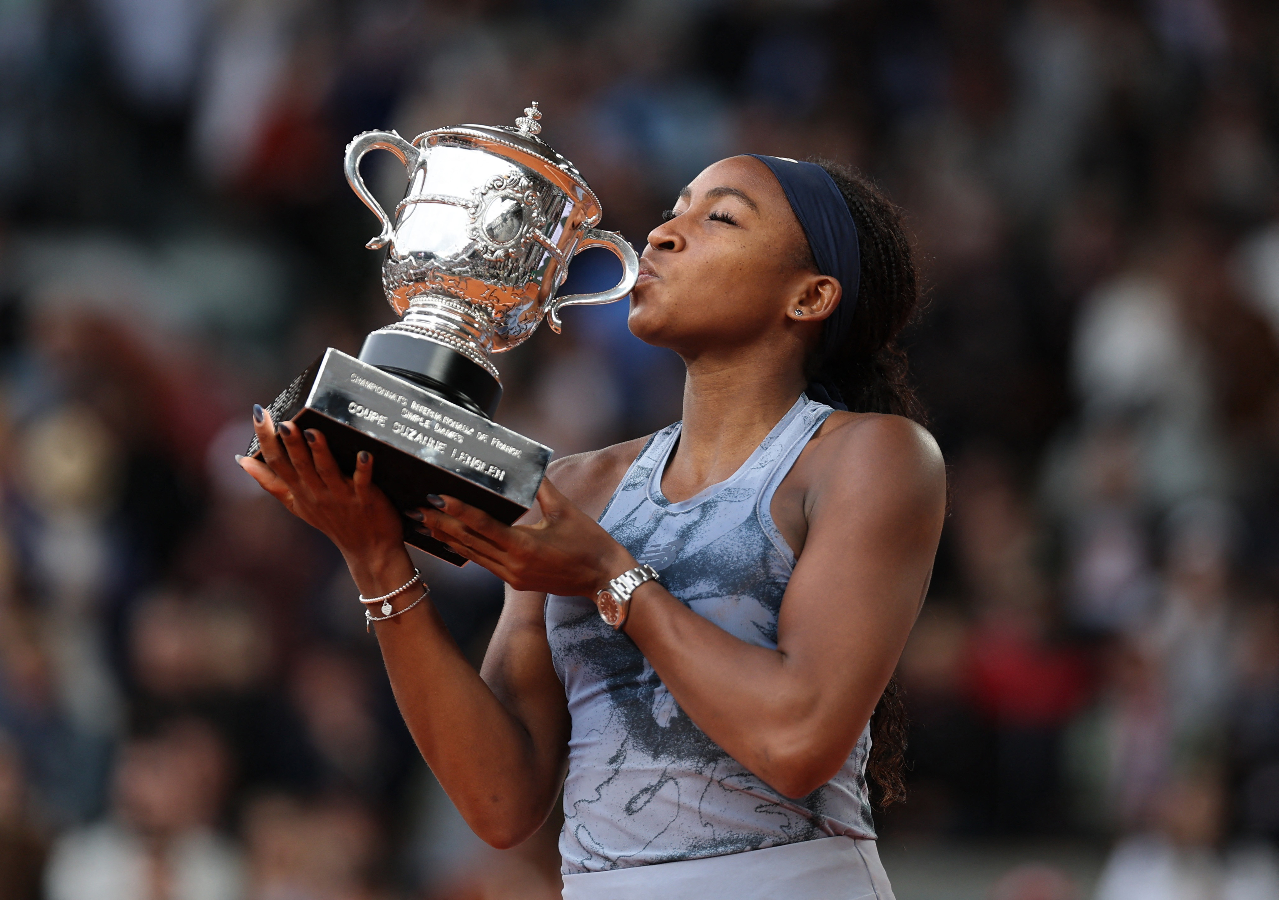 French Open - Roland Garros, Paris, France - June 7, 2025 Coco Gauff of the U.S. celebrates with the trophy after winning the women's singles final against Belarus' Aryna Sabalenka