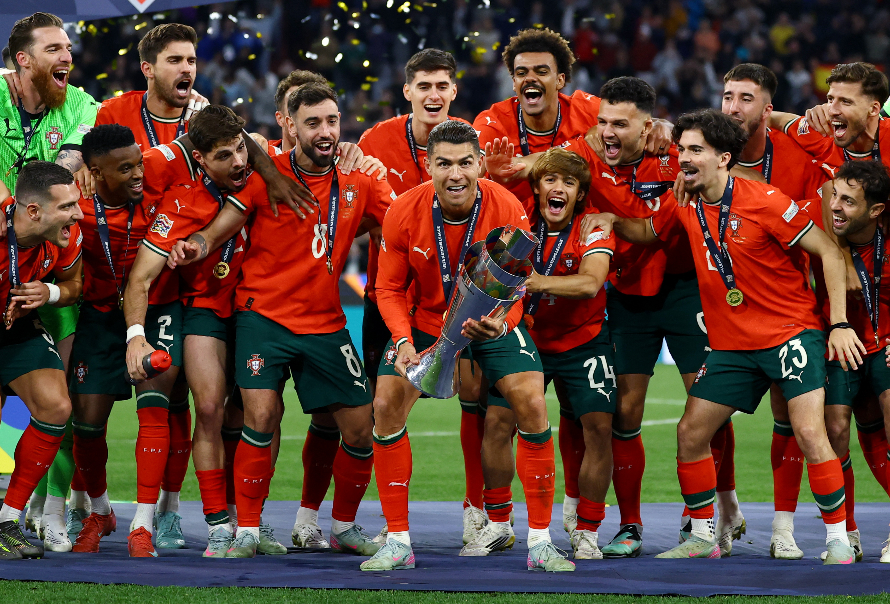  Nations League - Final - Portugal v Spain - Allianz Arena, Munich, Germany - June 8, 2025 Portugal's Cristiano Ronaldo lifts the trophy as he celebrates with teammates after winning the Nations League