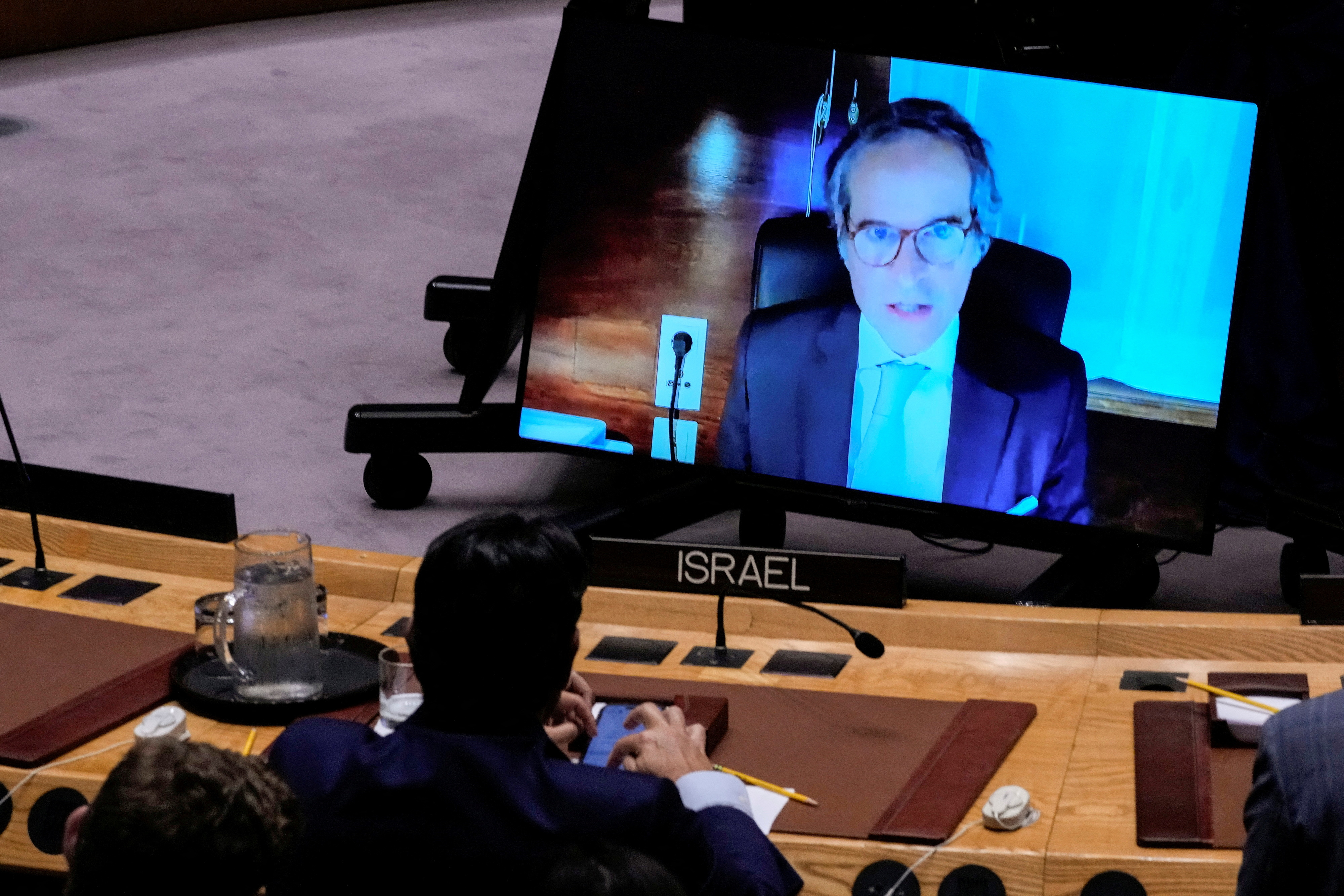 Israel's Ambassador Danny Danon listens to IAEA Director General Rafael Grossi on screen during a meeting of the United Nations Security Council, following Israel’s attack on Iran, at U.N. headquarters in New York City, U.S., June 13, 2025. REUTERS/Eduardo Munoz