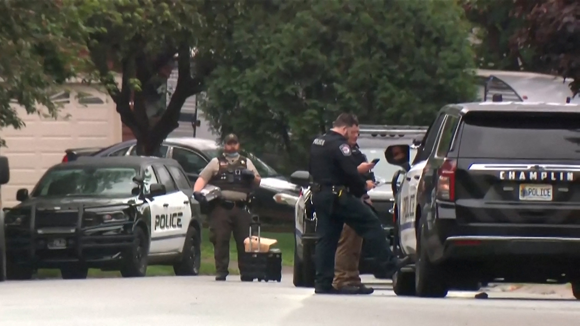 Police stand at a crime scene as they searched for a suspect posing as a police officer who shot two Democratic state lawmakers and their spouses in their homes, in the Minneapolis suburb of Champlin, Minnesota, U.S. June 14, 2025 in a still image from video. ABC Affiliate KTSP via REUTERS. NO RESALES. NO ARCHIVES THIS IMAGE HAS BEEN SUPPLIED BY A THIRD PARTY