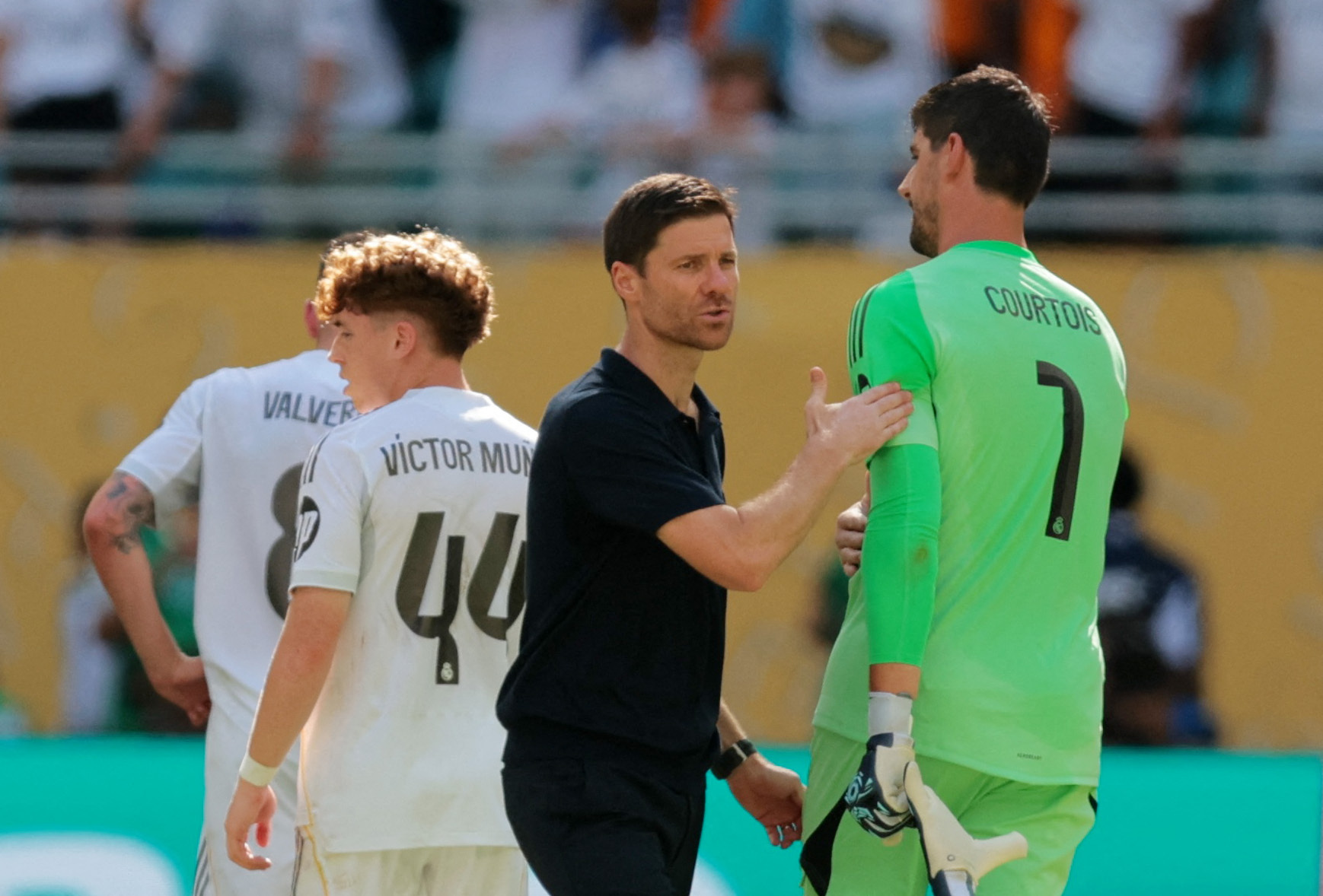 Real Madrid coach Xabi Alonso with Thibaut Courtois after the match