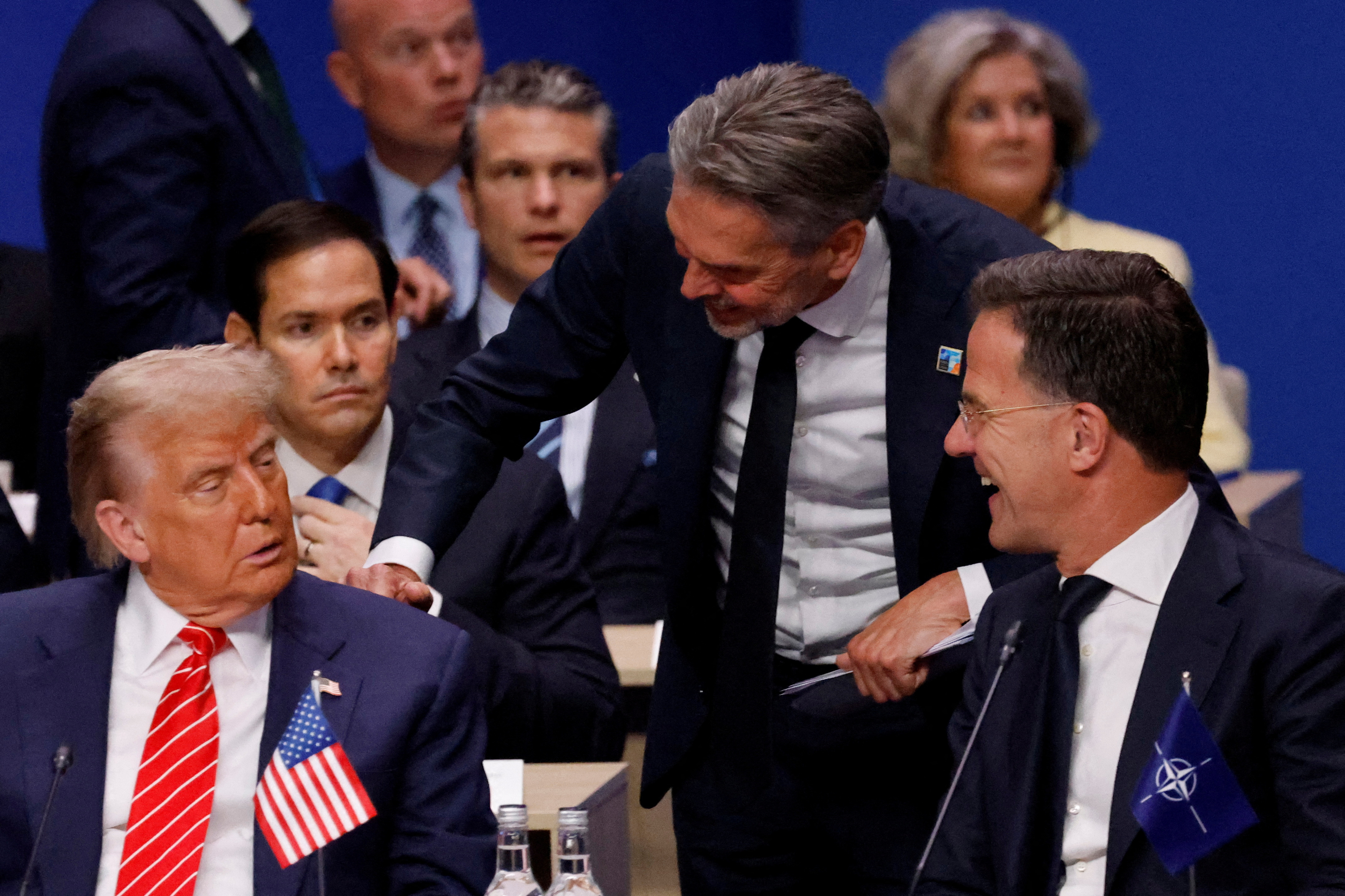 US President Donald Trump speaks with Netherlands' Prime Minister Dick Schoof and NATO Secretary General Mark Rutte.