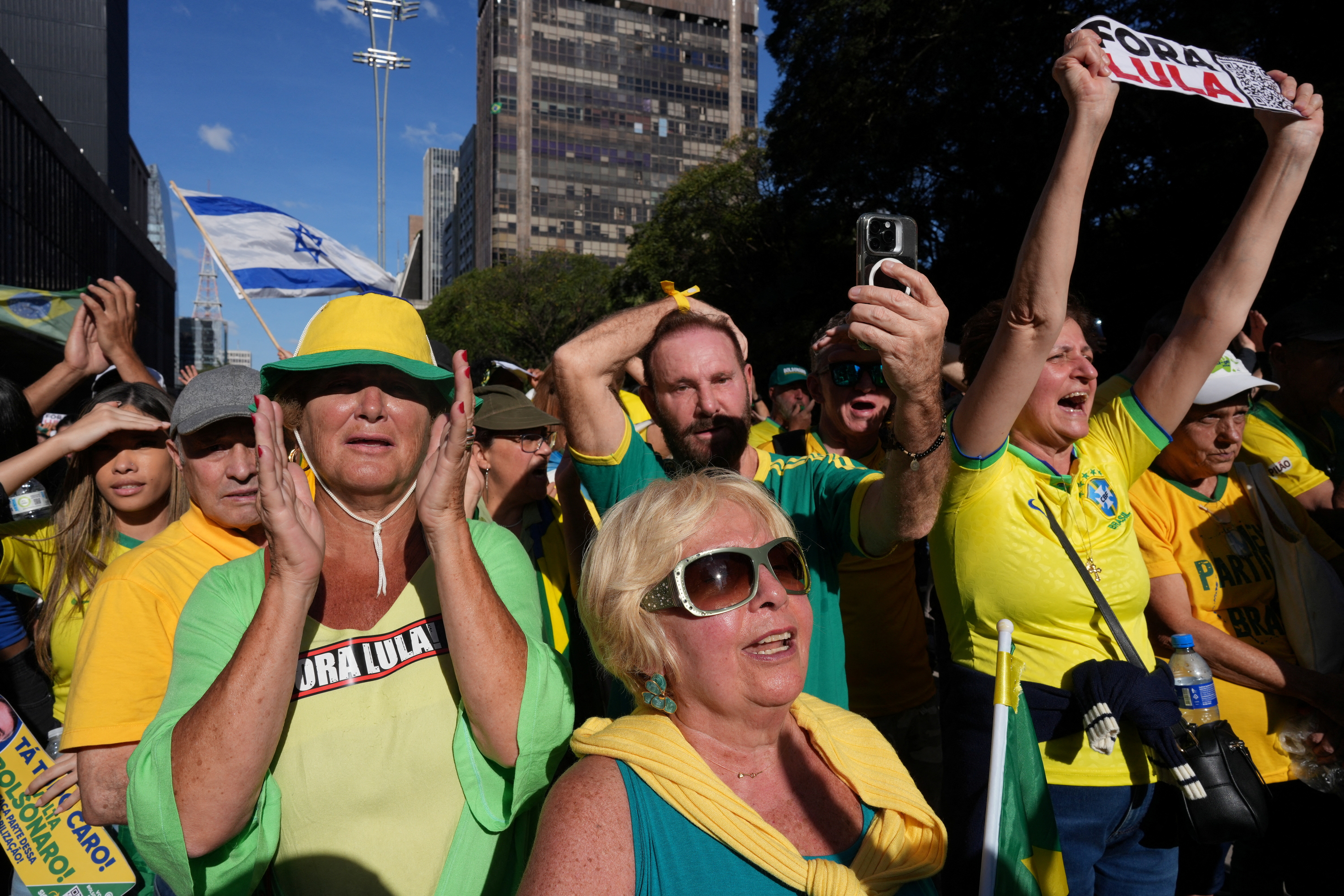 People gather in support of former Brazilian President Jair Bolsonaro, ahead of his trial in the Supreme Federal Court, in Paulista Avenue, Sao Paulo,