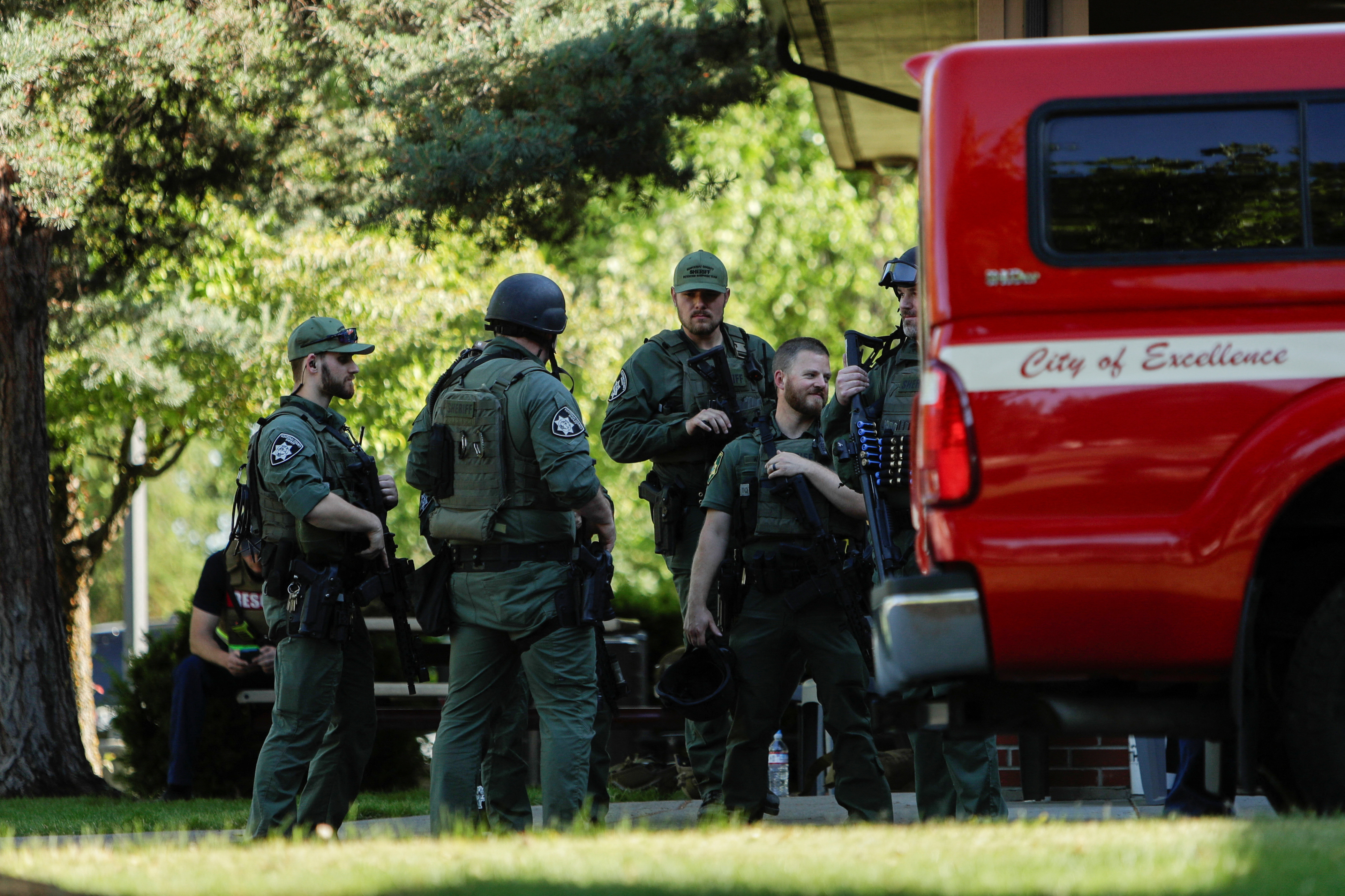 Law enforcement officers gather at Cherry Hill Park after multiple firefighters were attacked when responding to a fire in the Canfield Mountain area outside Coeur d’Alene, Idaho, U.S. June 29, 2025.