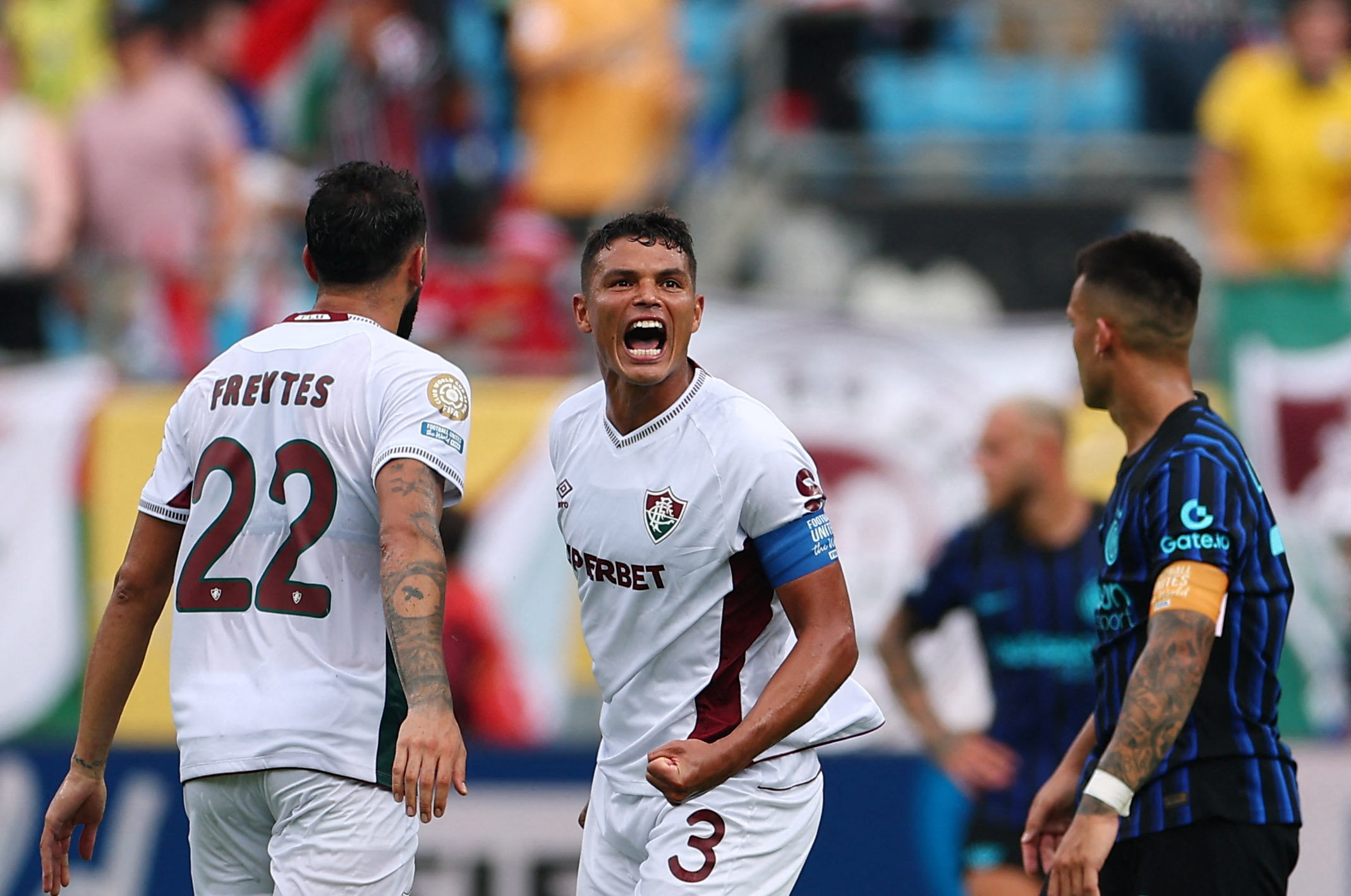 Fluminense's Thiago Silva and Juan Freytes celebrate after Hercules scores their second goal