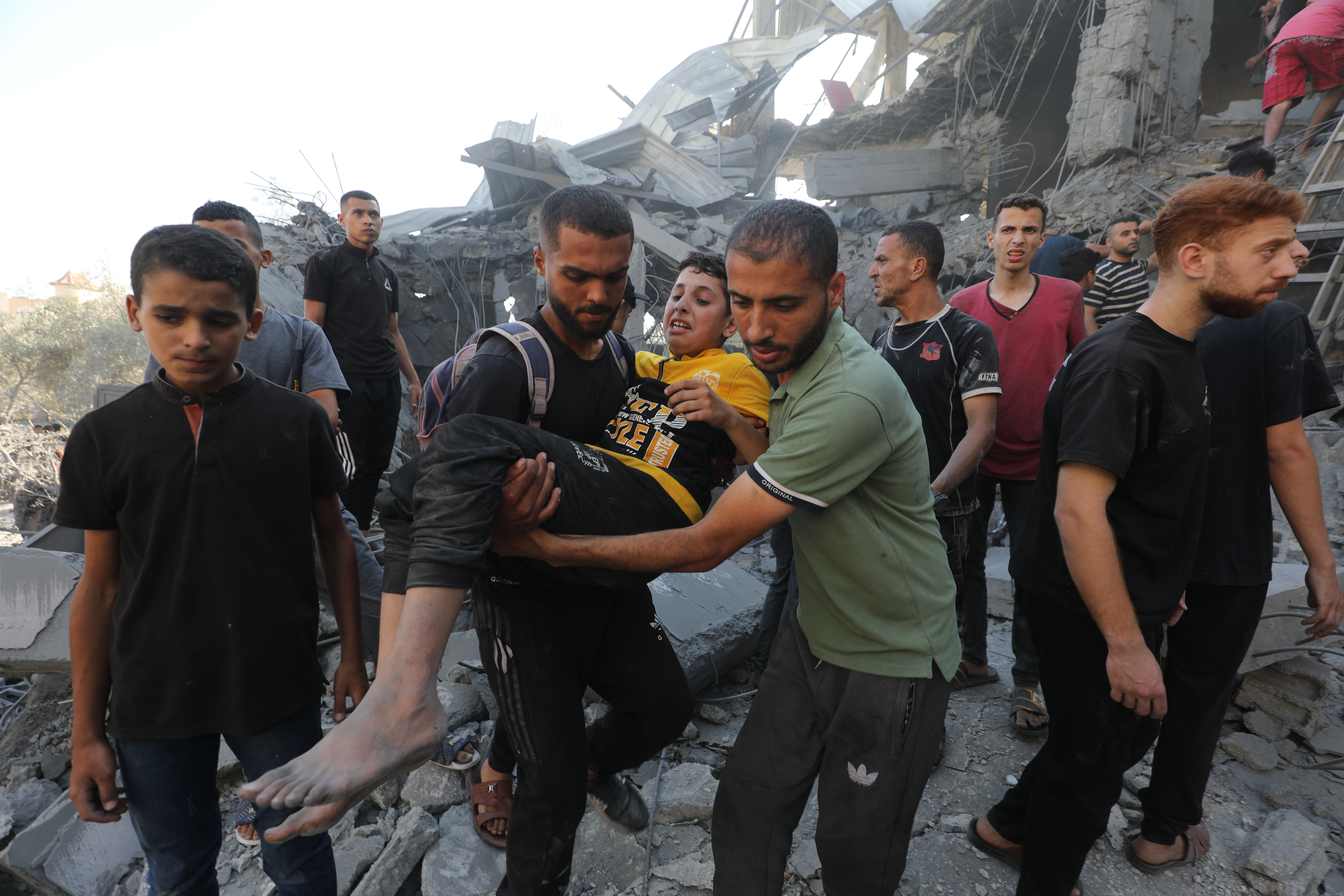 Officials and residents continue the search and rescue operation following the Israeli attacks on Nuseirat camp in Gaza on June 15, 2025