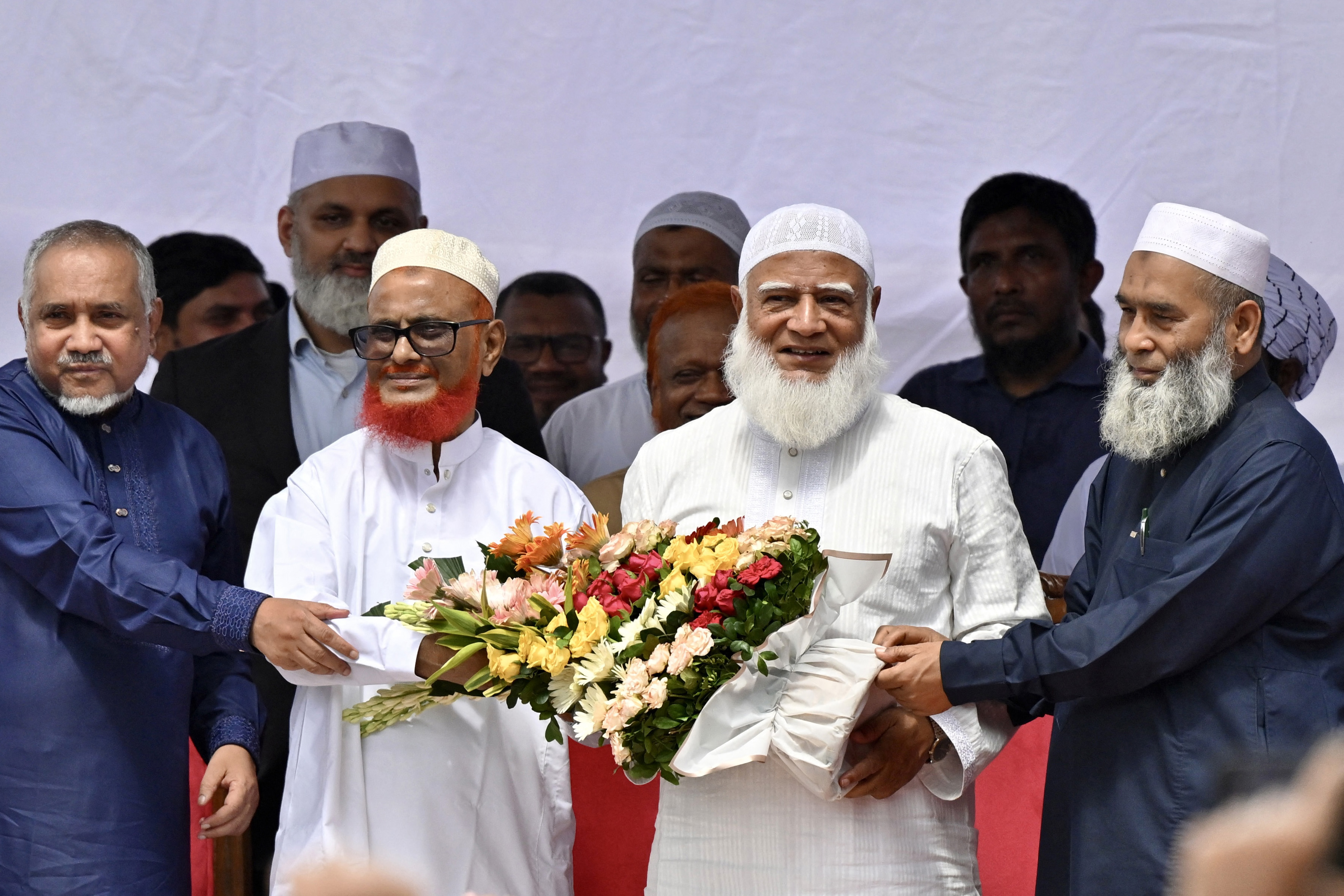 A.T.M. Azharul Islam, 2nd left, a key leader of Bangladesh's Jamaat-e-Islami after he was released from prison in Dhaka