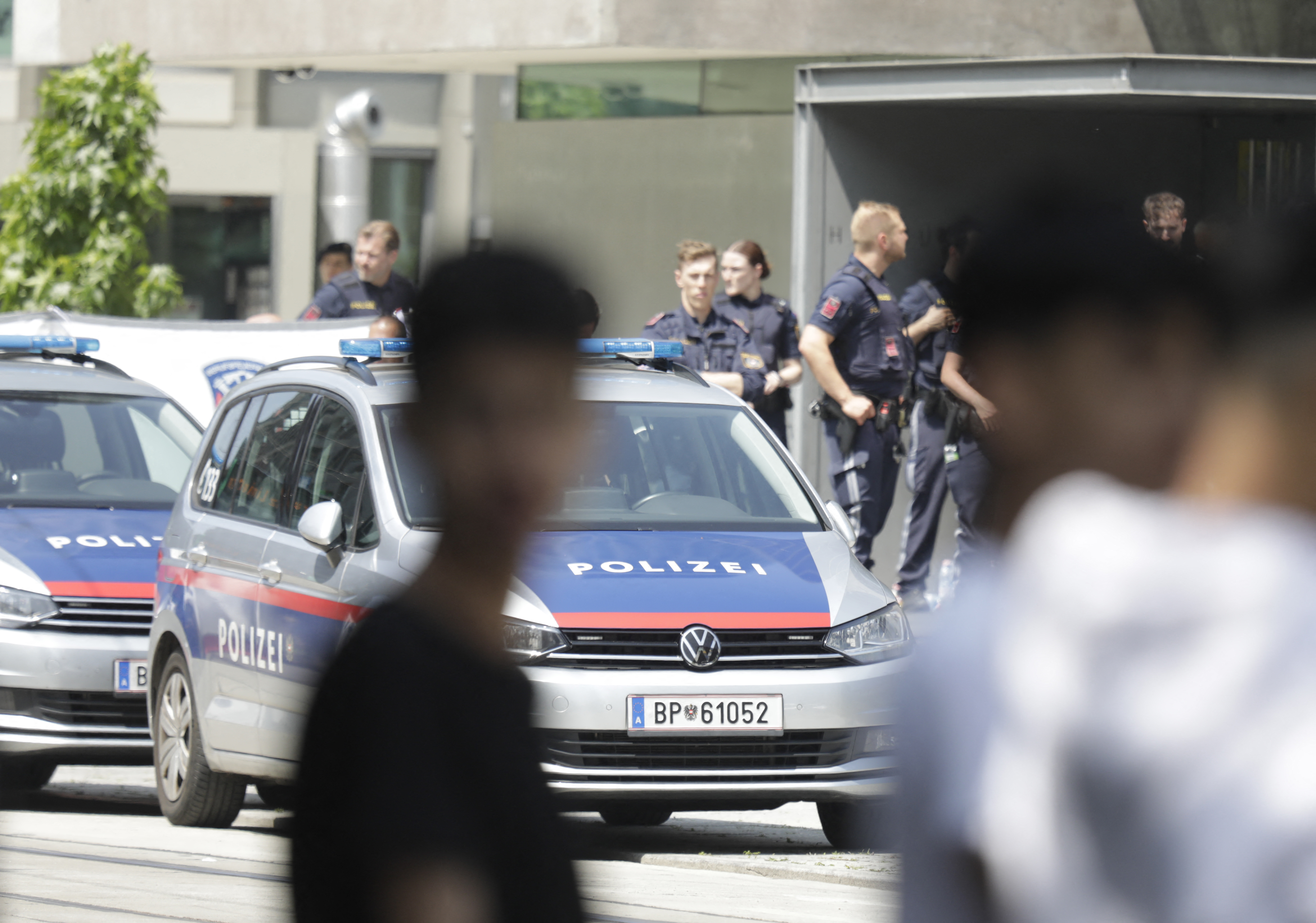 Police stand near a school
