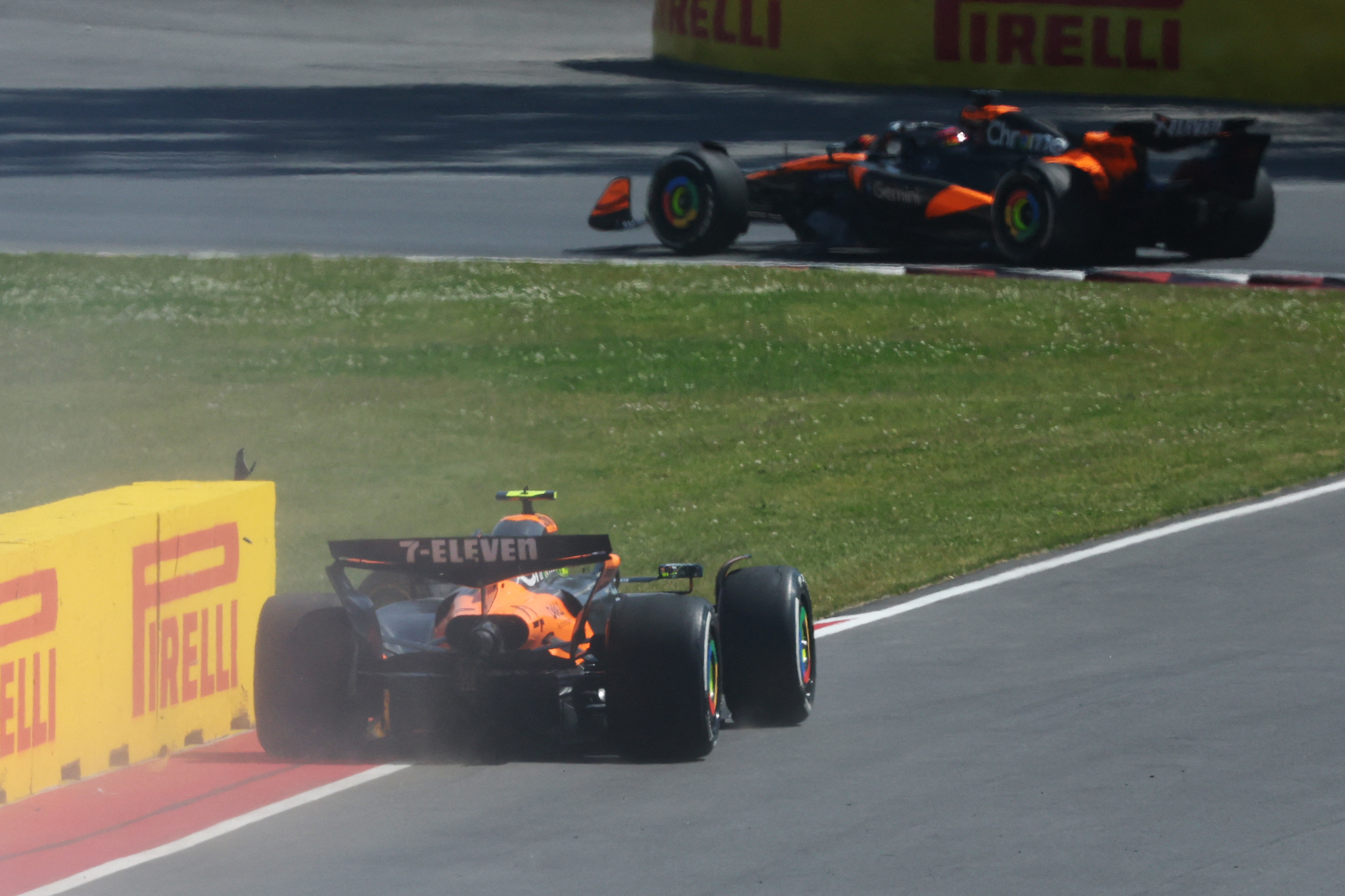 Lando Norris on side of track after crash.