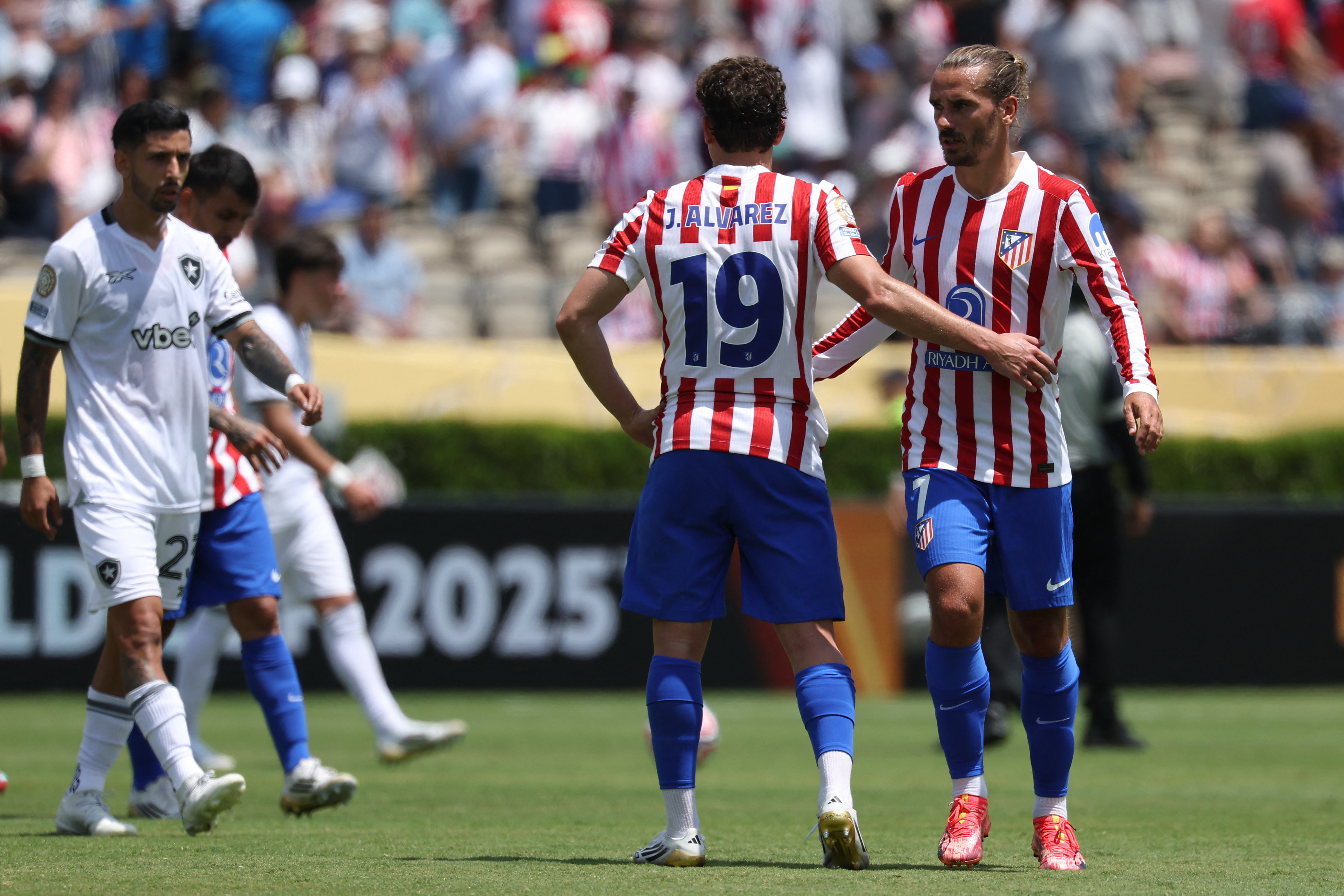 Atletico Madrid's Argentine forward #19 Julian Alvarez and teammate French forward #07 Antoine Griezmann react at the end of the FIFA Club World Cup 2025 Group B football match between Spain's Atletico de Madrid and Brazil's Botafogo at the Rose Bowl stadium in Los Angeles on June 23, 2025. (Photo by Patrick T. Fallon / AFP)