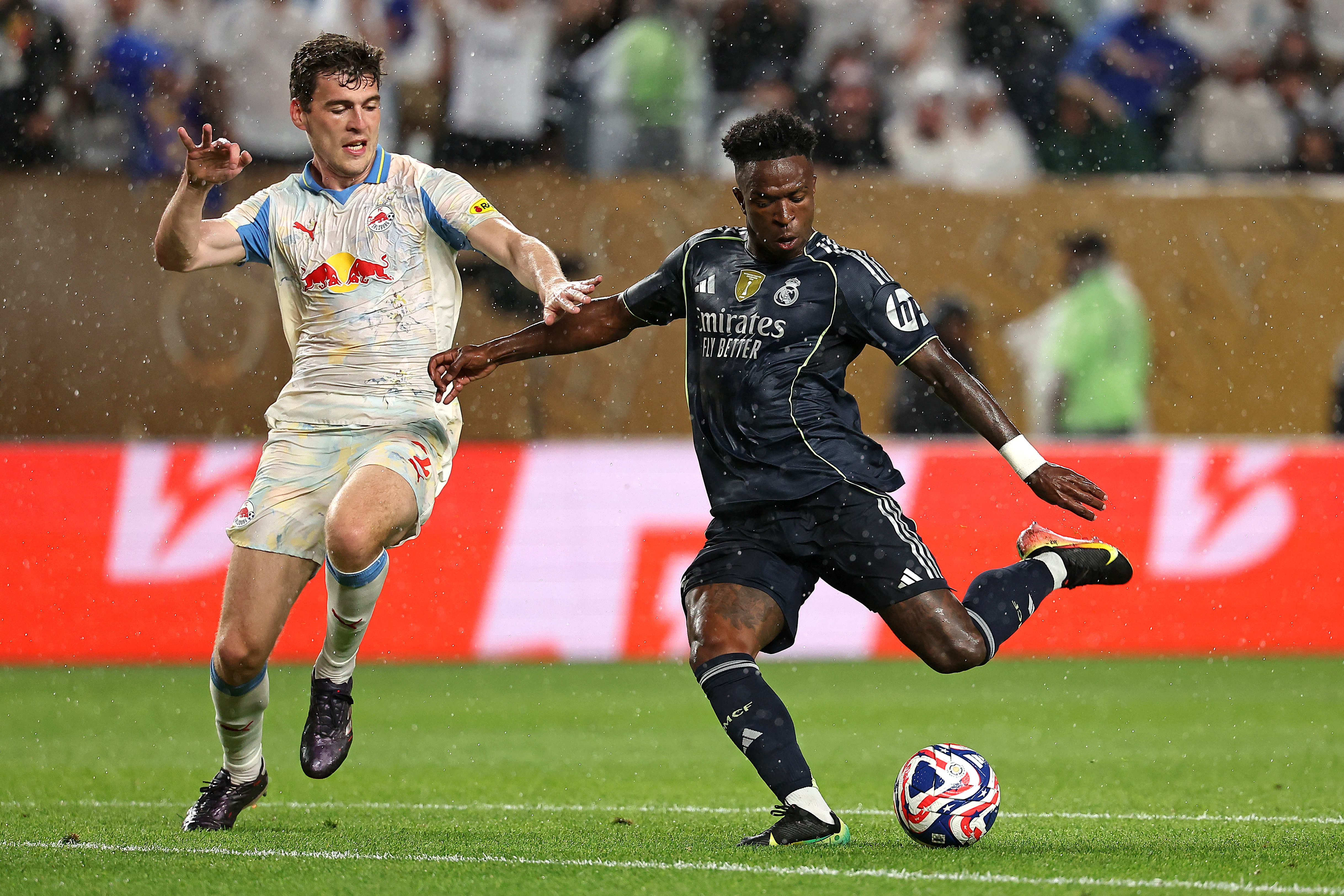 Real Madrid's Brazilian forward #07 Vinicius Junior (R) scores his team's first goal during the FIFA Club World Cup 2025 Group H football match