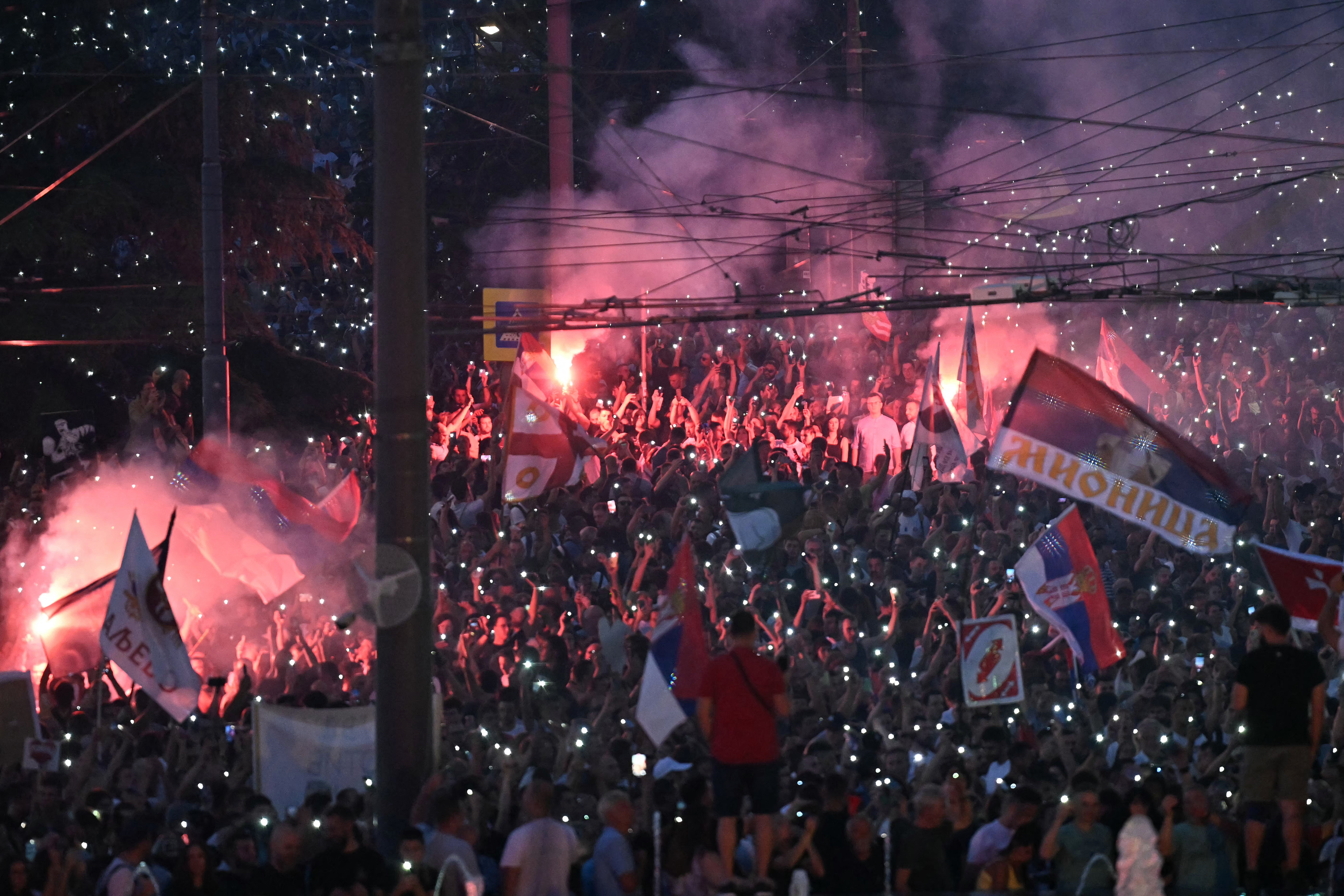 Anti-government protesters clash with riot police in Serbia