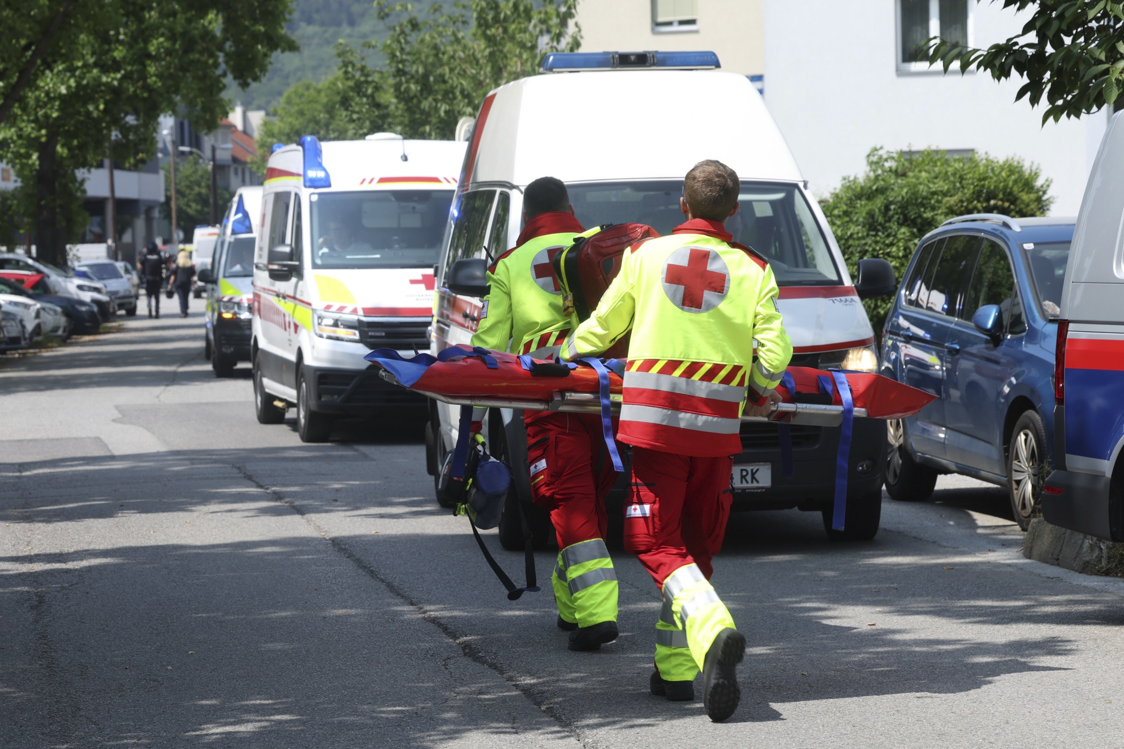 Rescue service personnel attend the scene of a shooting at a school in Graz, Austria, Tuesday, June 10, 2025. (Kleine Zeitung via AP)