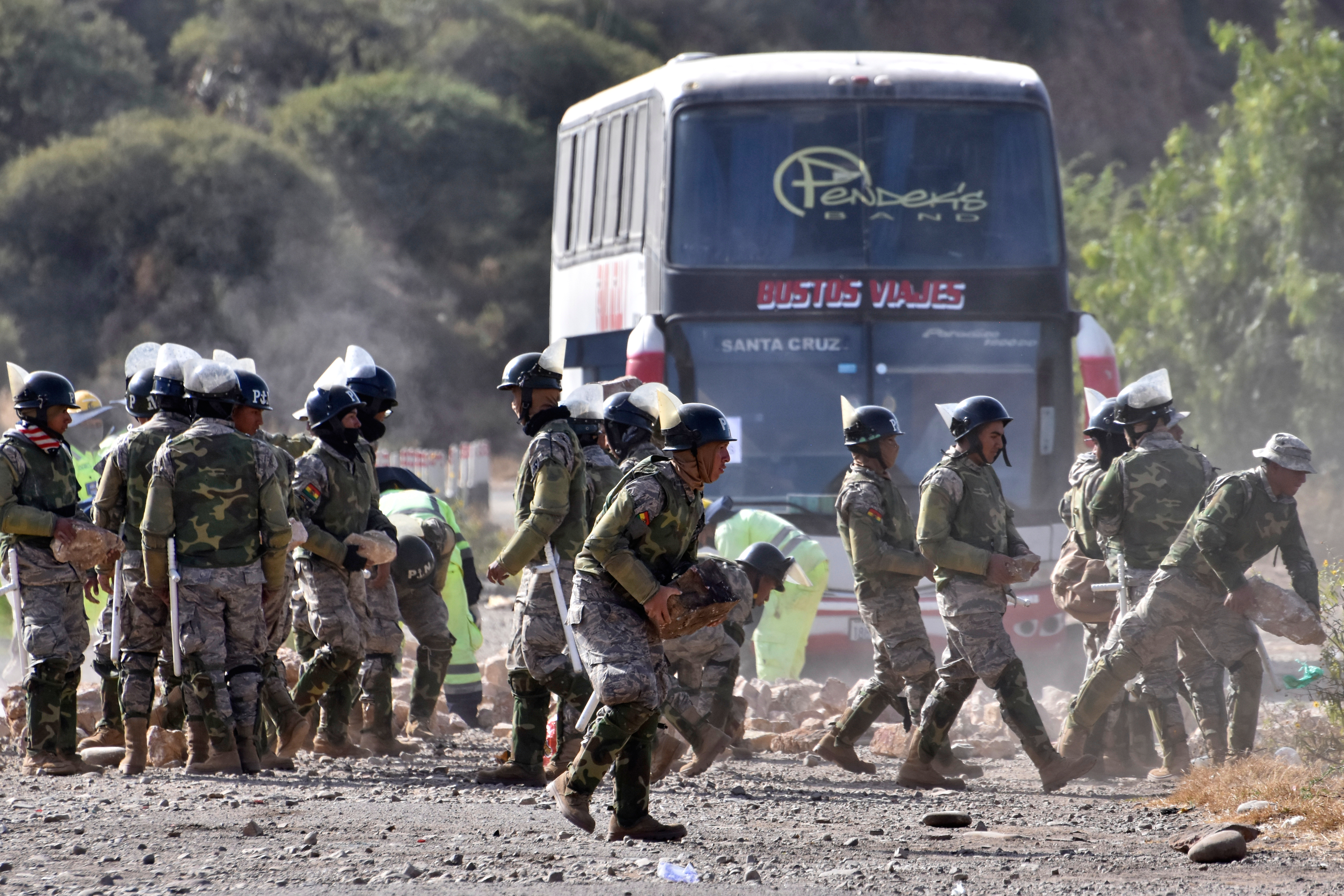 Soldiers clear a roadblock in Bolivia