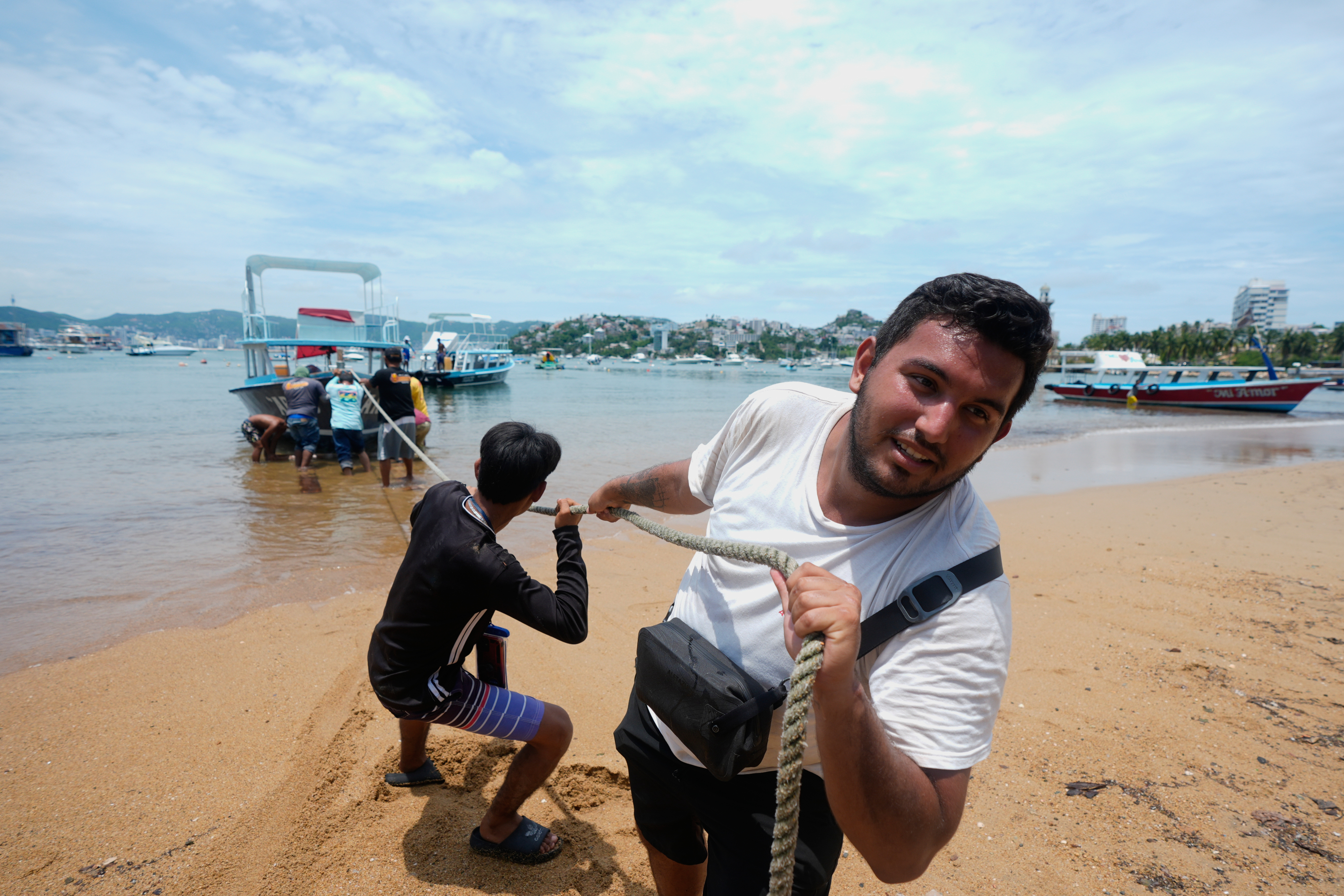 Boats are removed from the water to Manzanillo beach ahead of the arrival of Hurricane Erick in Acapulco, Mexico